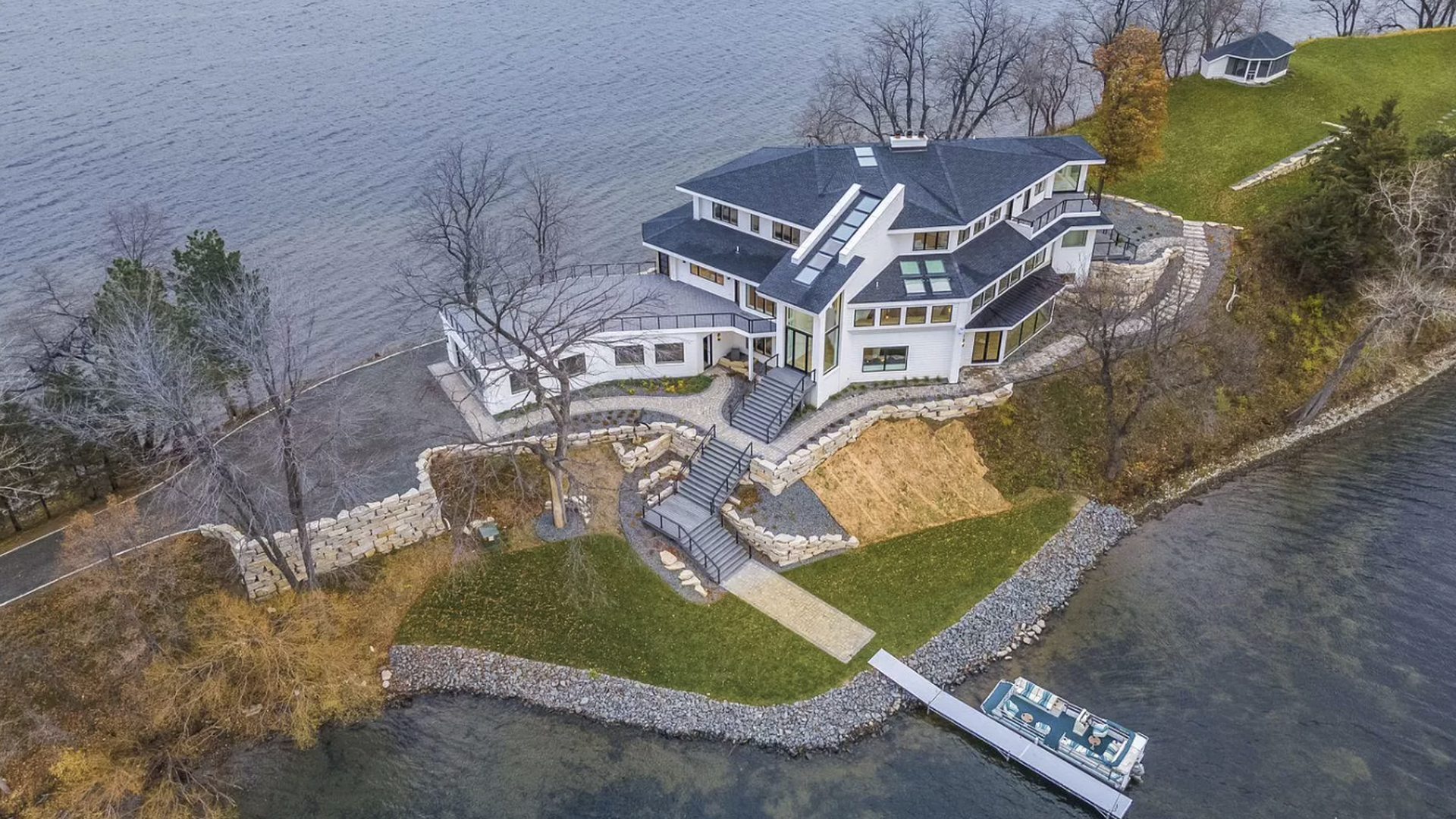 A drone aerial photo of a private island mansion for sale in Minnesota.