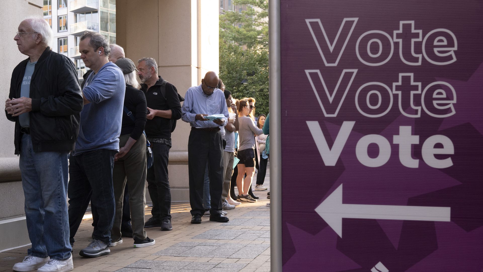 Voters line up to cast their ballot as early voting starts in the US national elections in Arlington, Virginia, on September 20, 2024. Early in-person voting for the 2024 US presidential election began in Virginia, South Dakota and Minnesota. (Photo by AFP) (Photo by -/AFP via Getty Images)