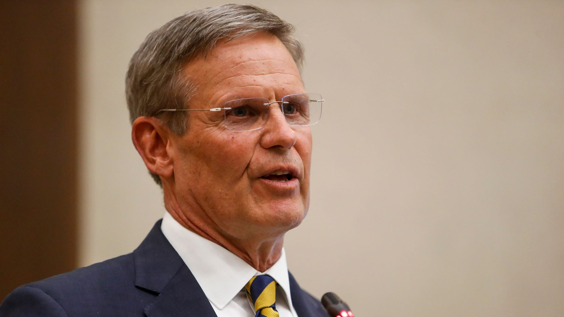 Gov. Bill Lee speaks into a microphone.
