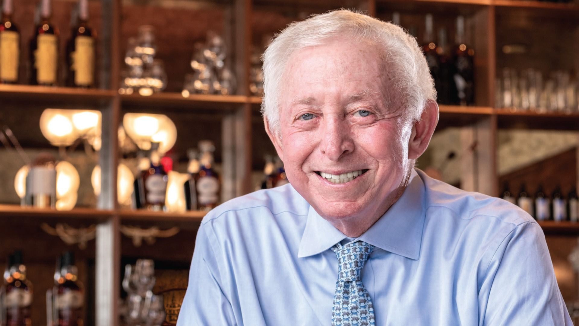 Photo shows a man in a suit.