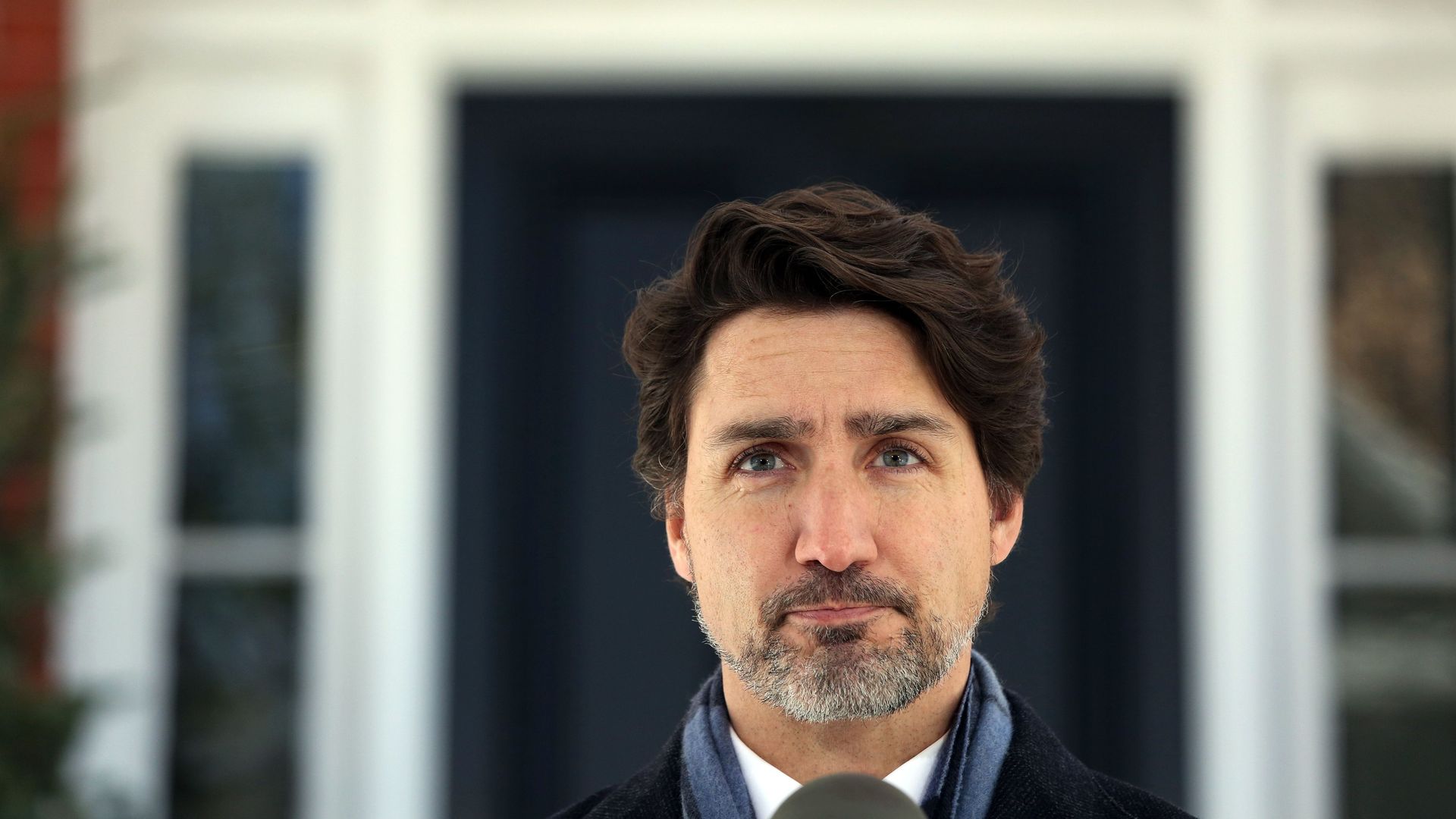 In this image, Trudeau stands outside