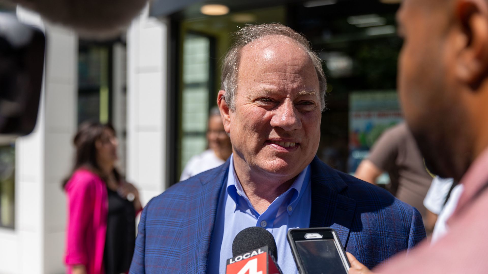 Mayor Mike Duggan speaks to press at an event. 
