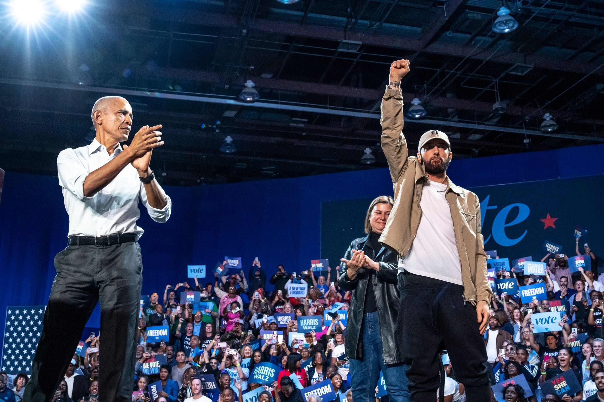 Former president Barack Obama cheers on Eminem after he introduced him to the stage to speak while campaigning for Kamala Harris in Detroit 