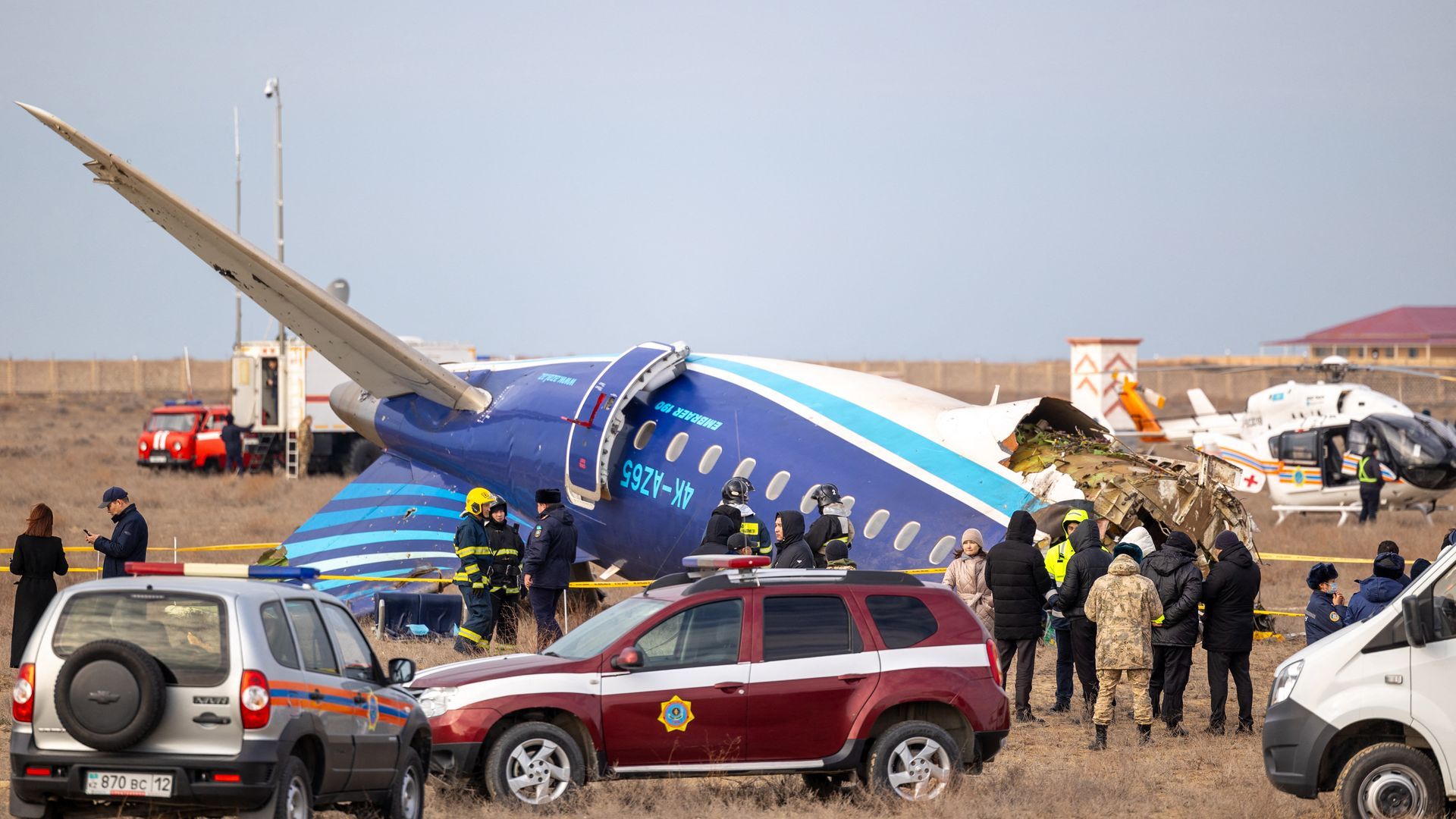 Emergency specialists work at the crash site of an Azerbaijan Airlines passenger jet near the western Kazakh city of Aktau on Dec. 25. 
