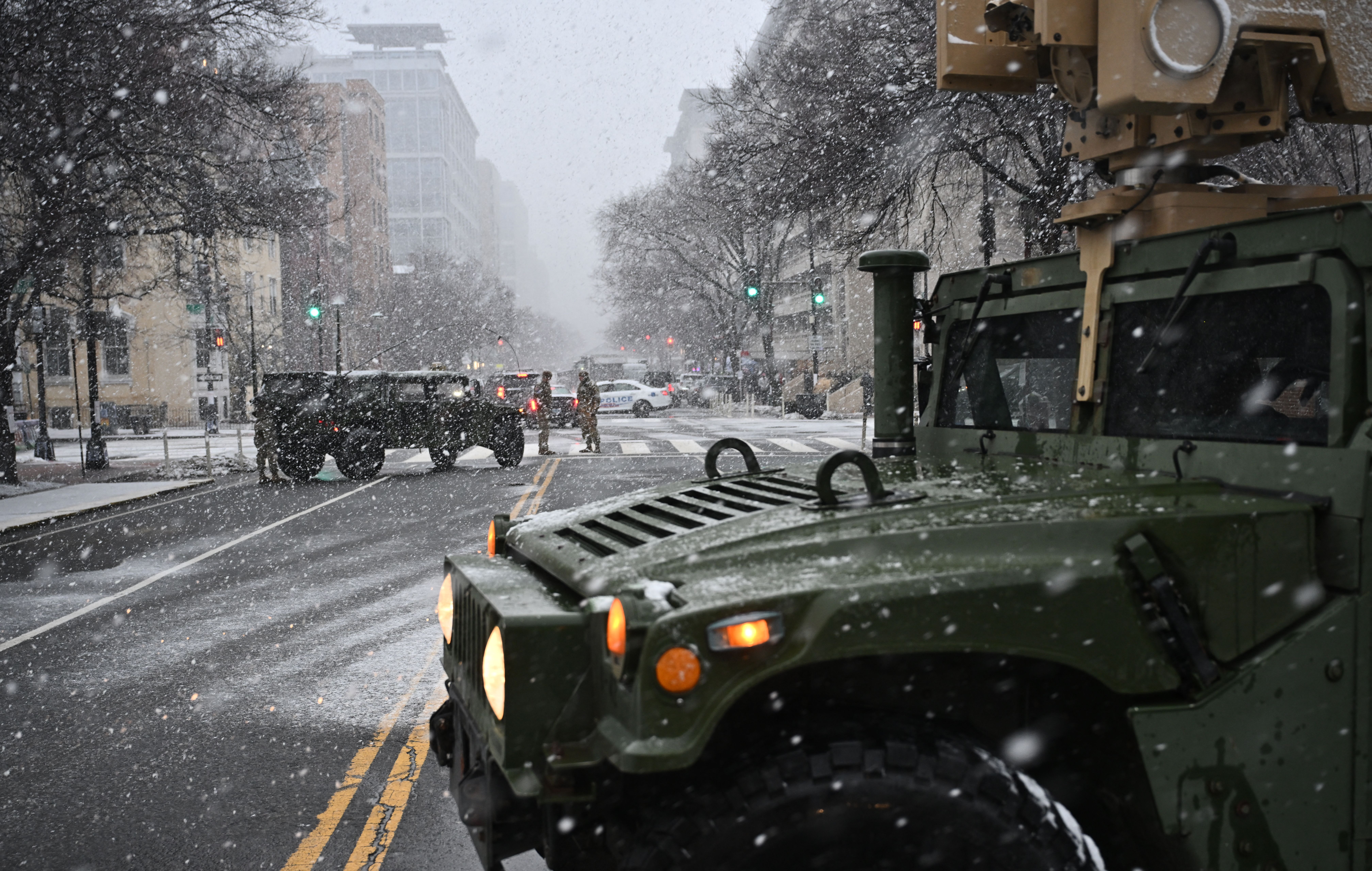 A photo of military vehicles on a street in Washington, D.C.