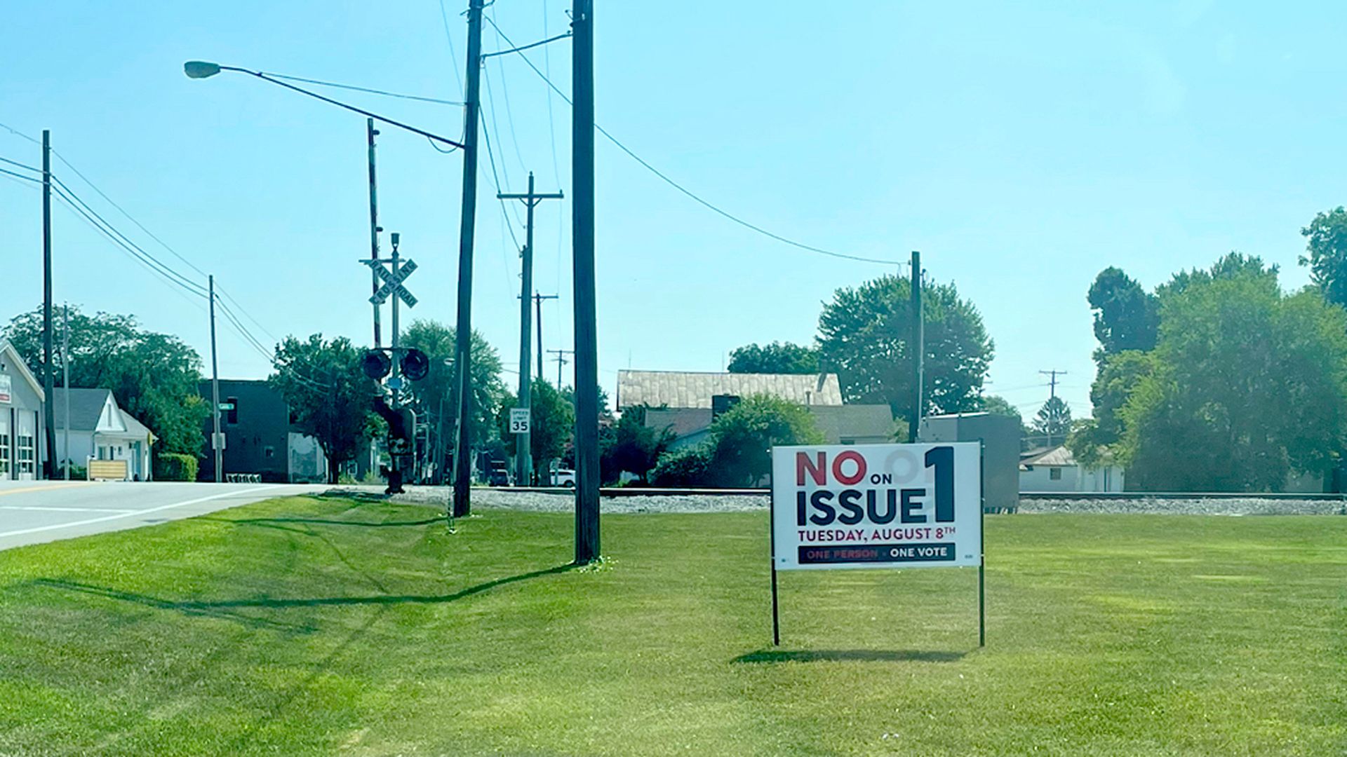 A vote No on Issue 1 sign on a grassy plot in rural Ohio