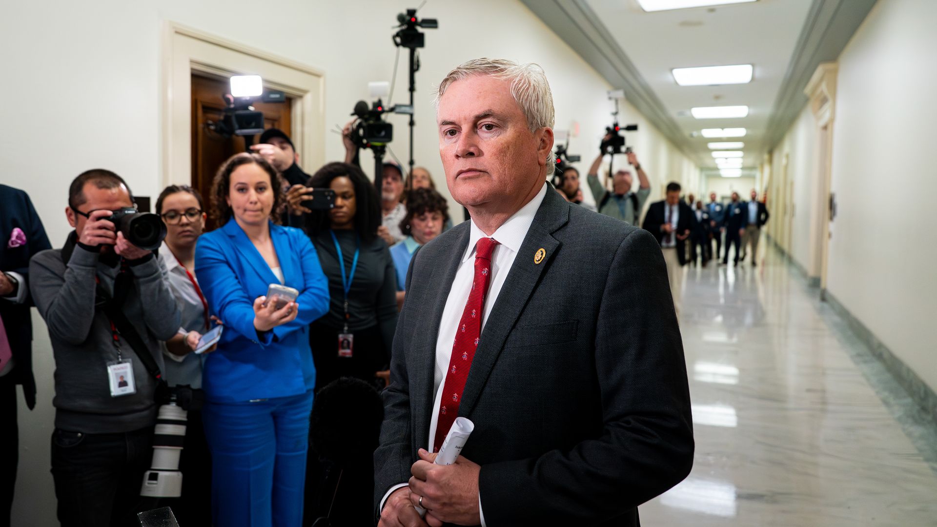 James Comer in a Capitol Hill hallway with reporters in the background