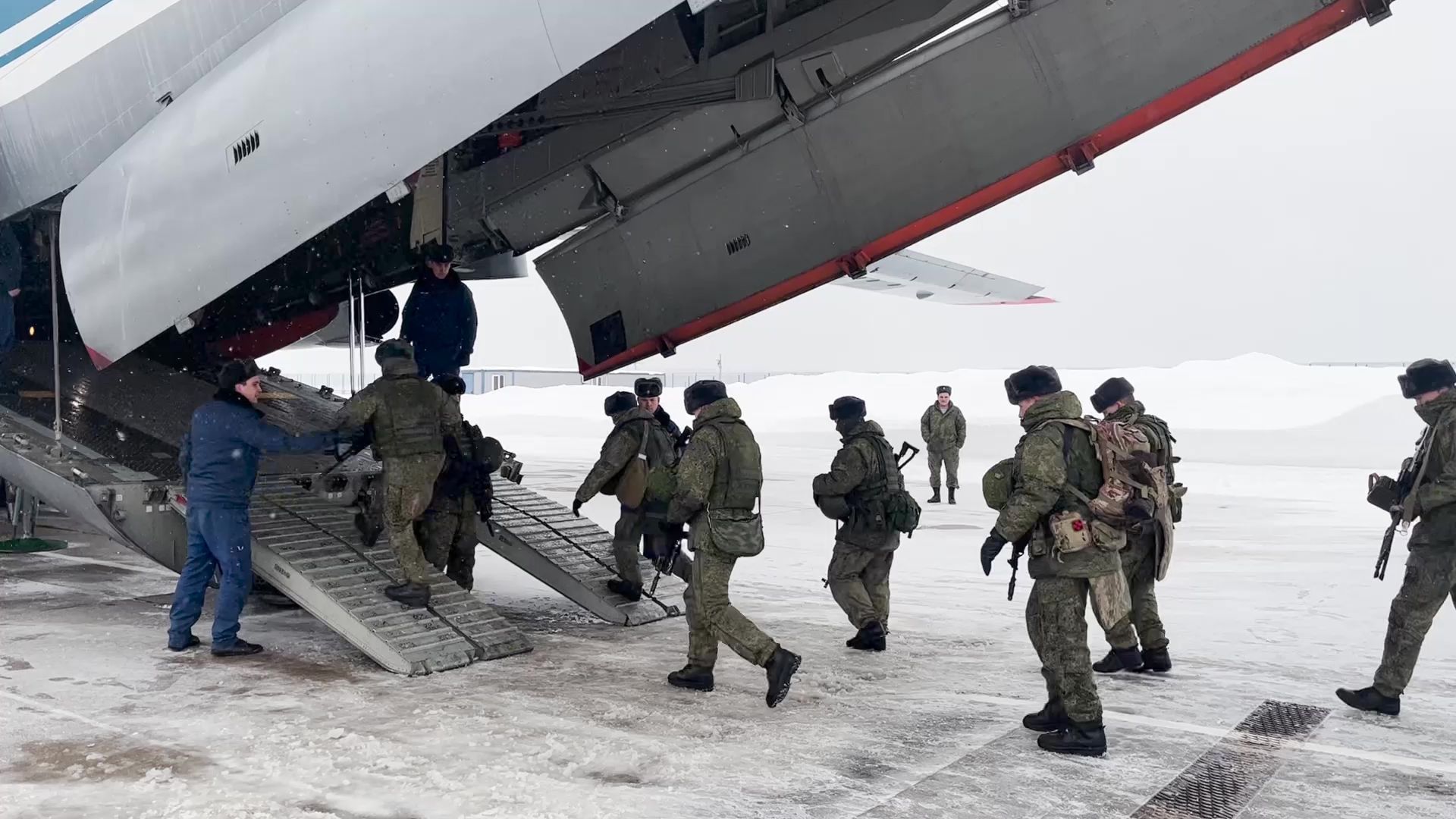 Russian troops boarding a military aircraft in Moscow on their way to Kazakhstan