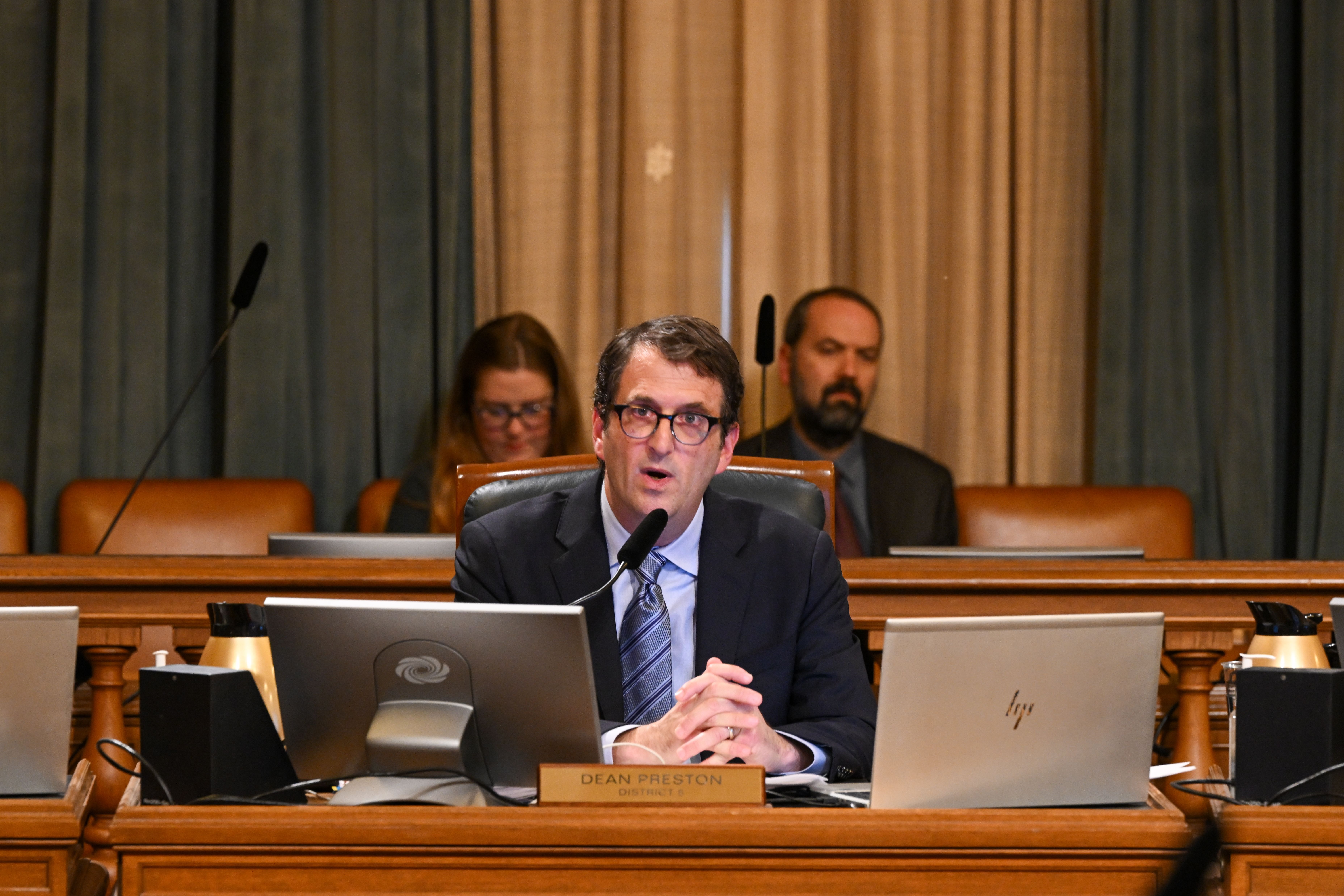 man speks in supervisor chamber