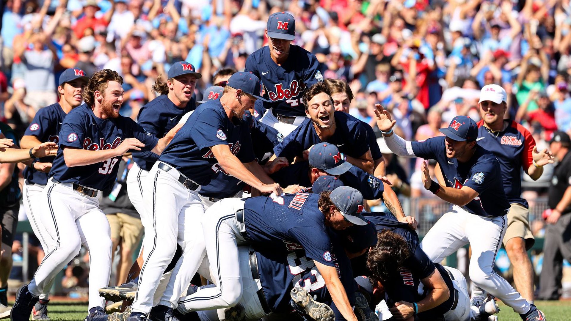 The Ole Miss Rebels celebrate on the field.