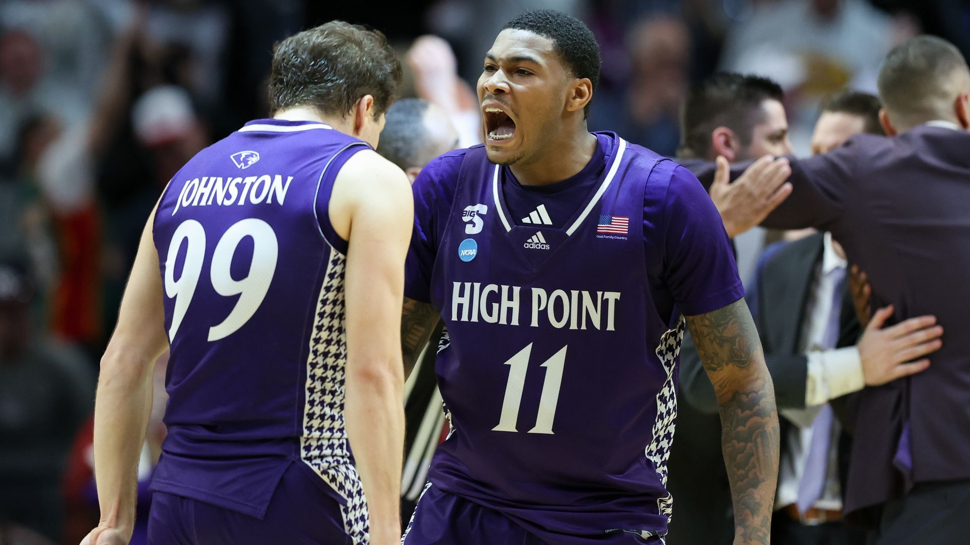 High Point forward Cam'Ron Fletcher (No. 11) celebrates with guard Chase Johnston during yesterday's second half in Portland, Ore. Photo: Amanda Loman/AP