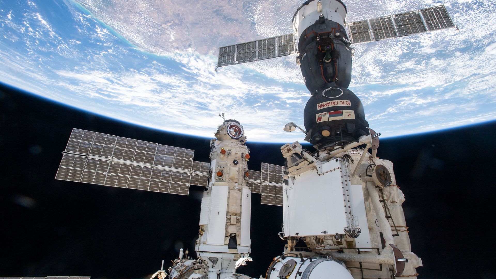 Russia's Nauka module docked to the International Space Station with Earth in the background