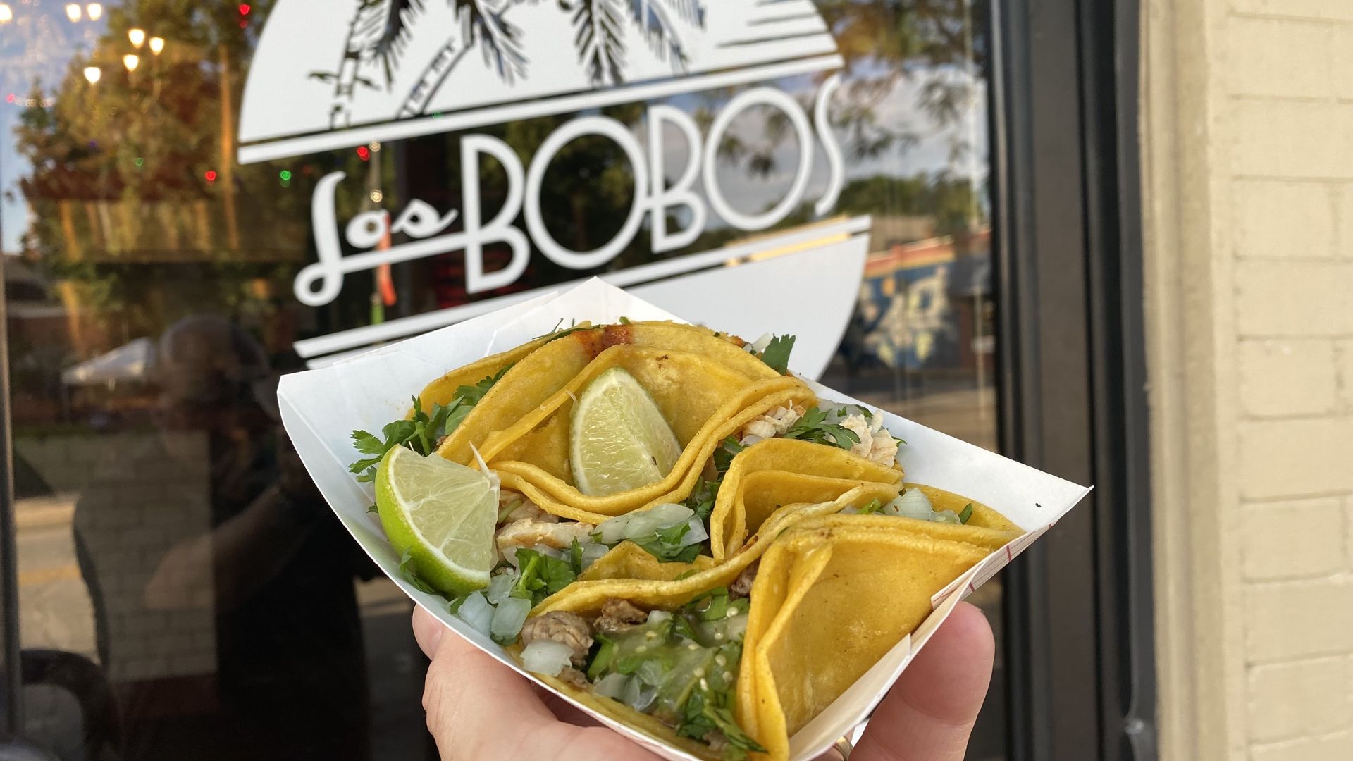 A container of street tacos. 