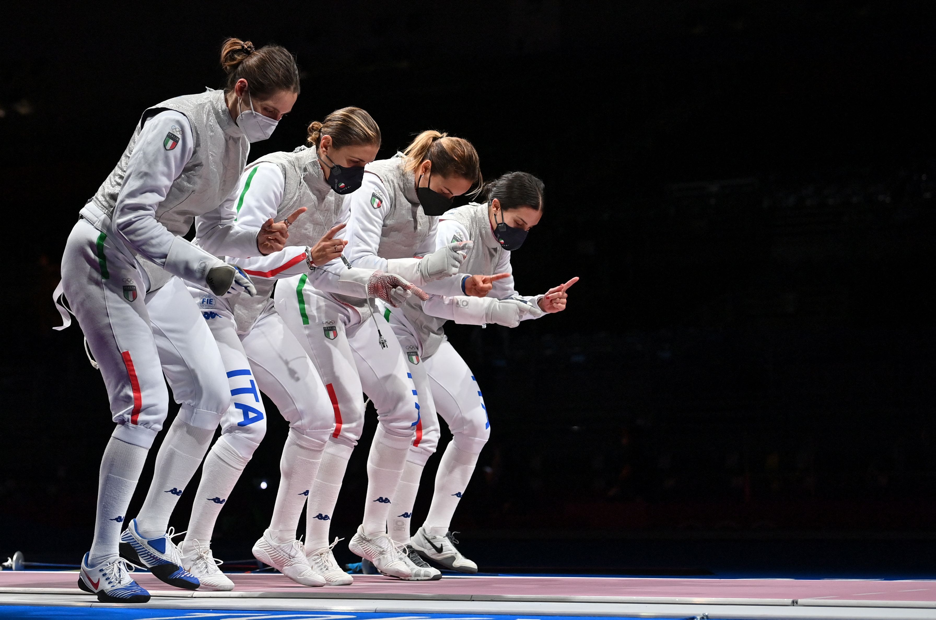   Italy's fencer team warm up prior the match against France in the women's foil team semifinal bout during the Tokyo 2020 Olympic Games on July 29