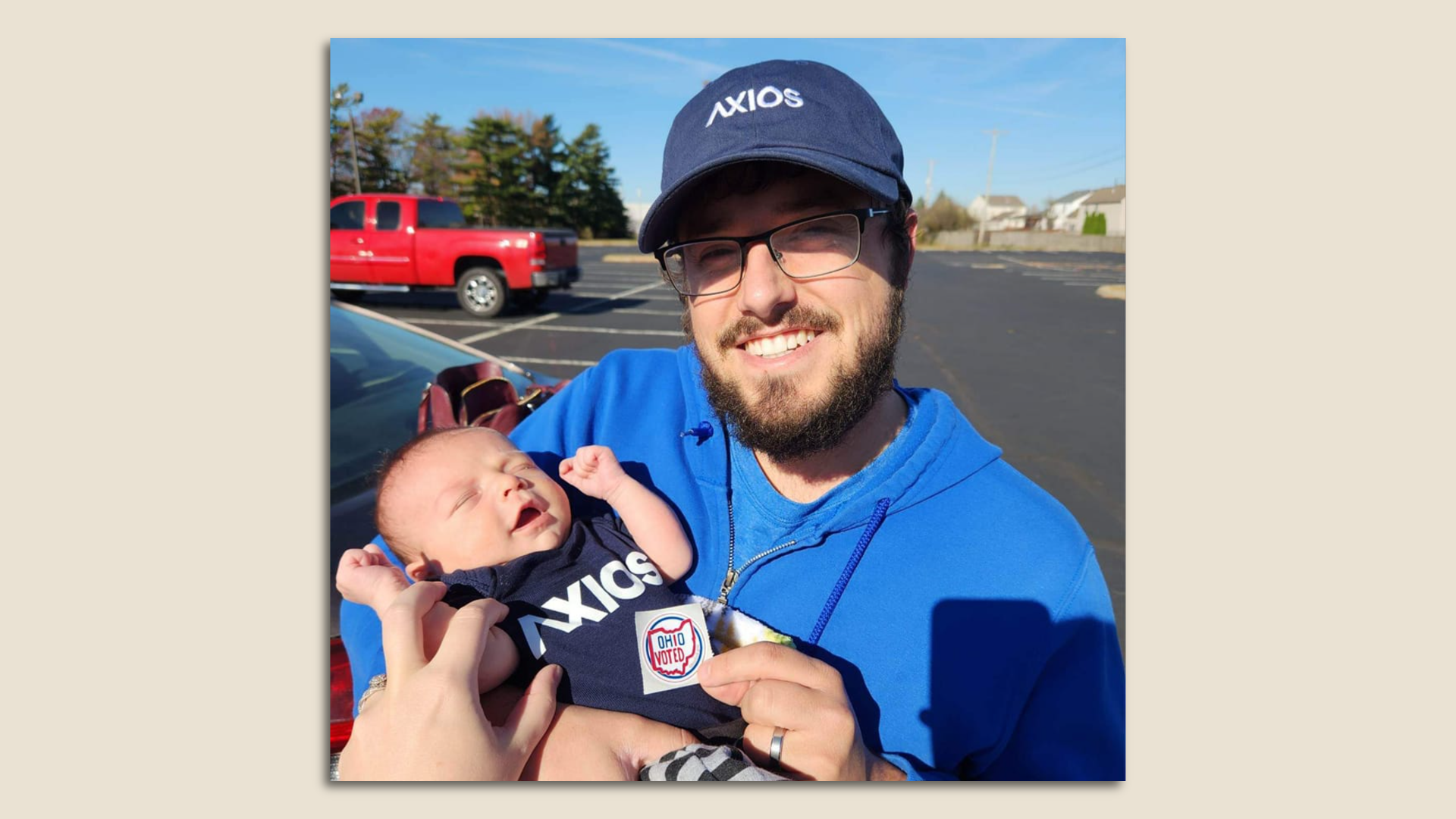 Axios reporter and son with an "I voted" sticker.