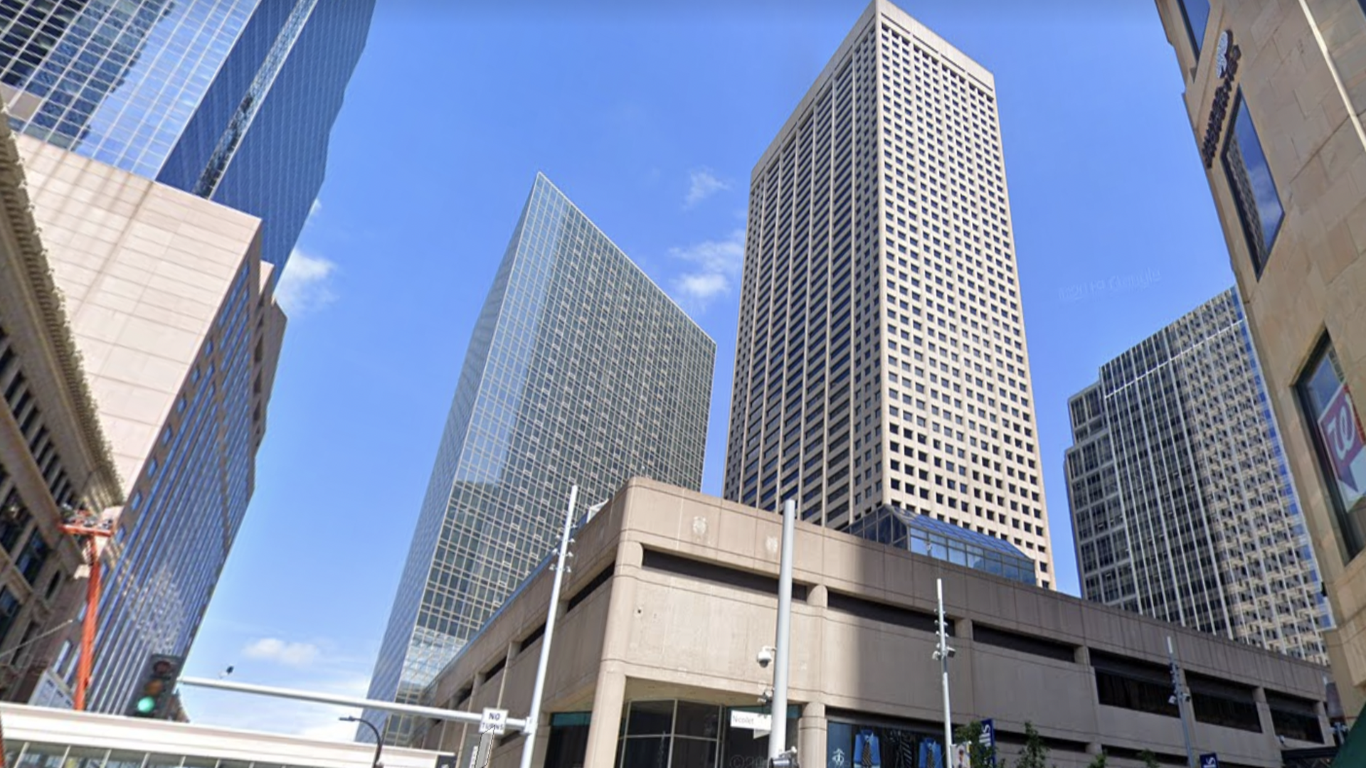 The City Center tower is light brown and stands 52 stories.