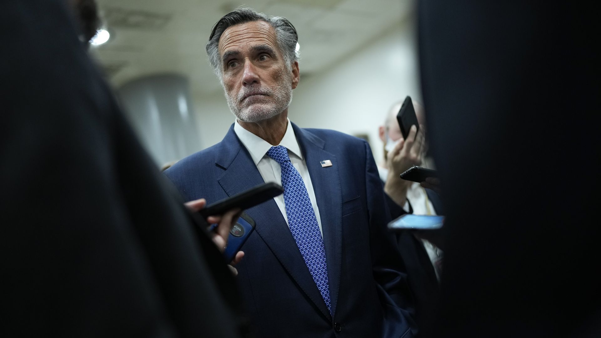 Mitt Romney being questioned by reporters. 