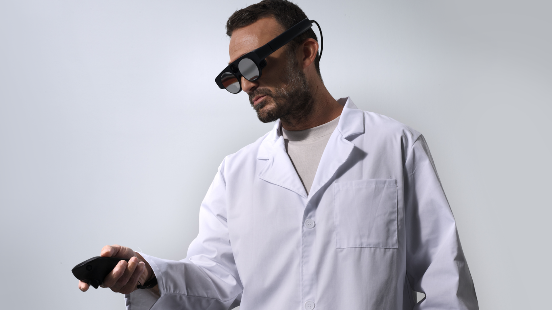 A man in a medical coat wearing Magic Leap's second-generation AR headset