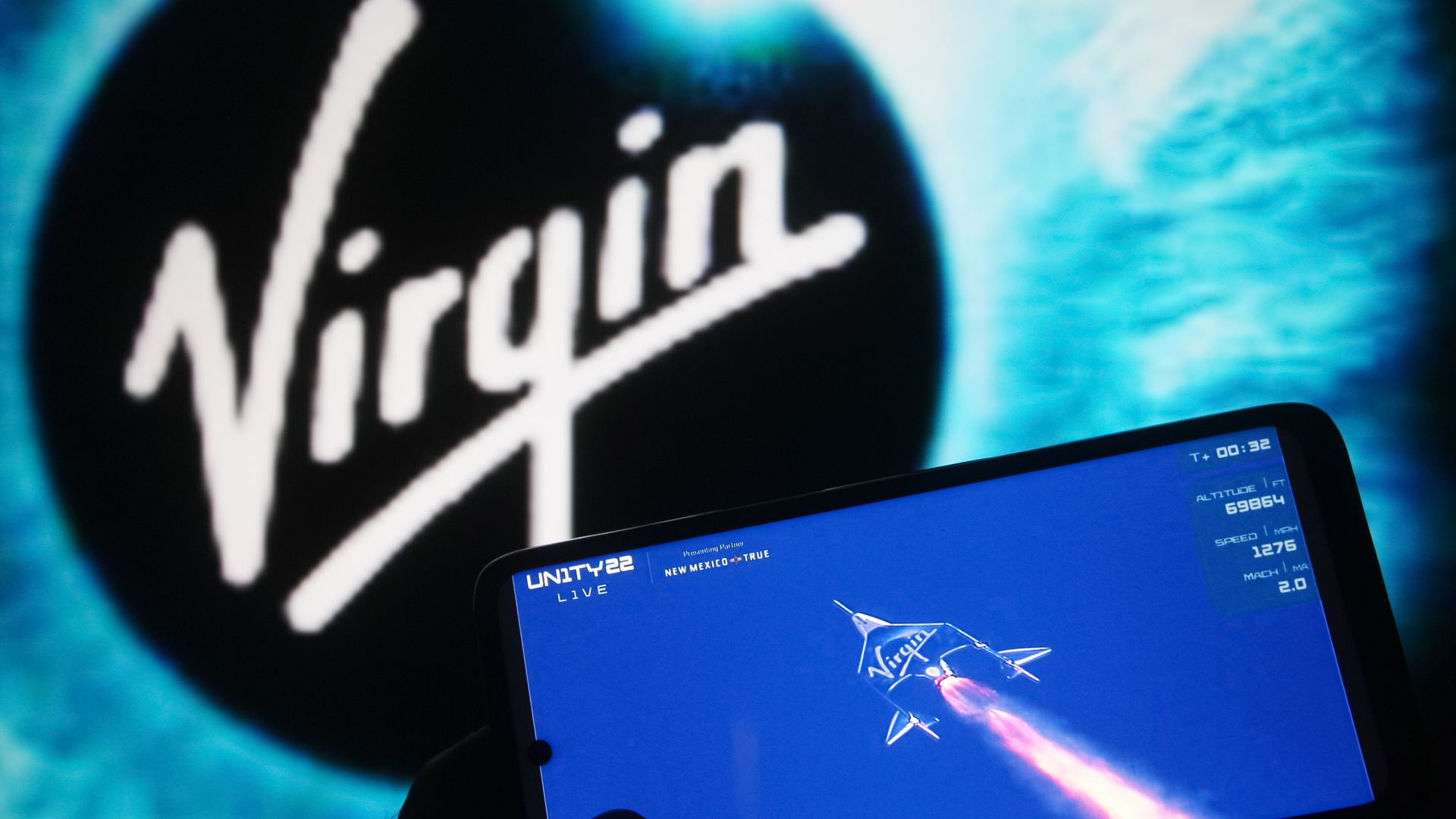 Mobile screen tracking a rocket launch, with a virgin logo in the background
