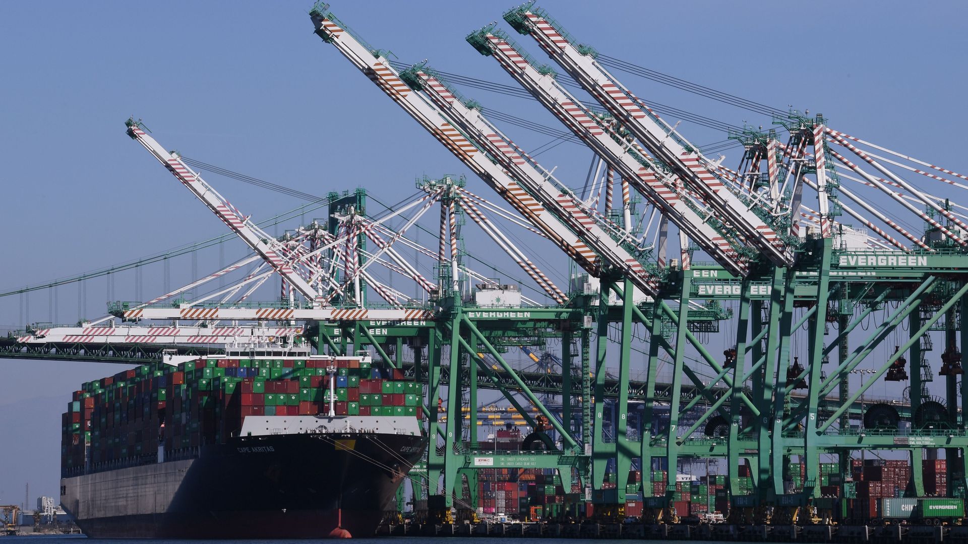 Shipping containers are unloaded at the Port of Long Beach, in Los Angeles County