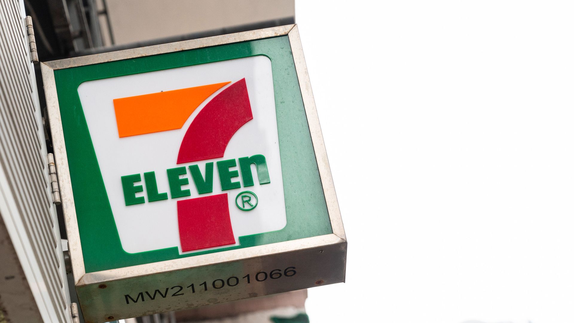 Company logo sign from the Japanese-owned American international chain of convenience, 7-Eleven, seen outside its store in Hong Kong. 