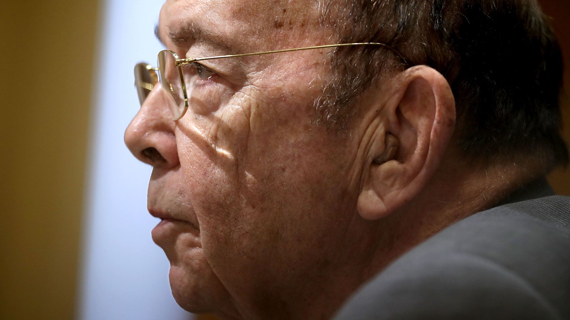 Close up of wilbur ross's face. Bald white man with glasses. 