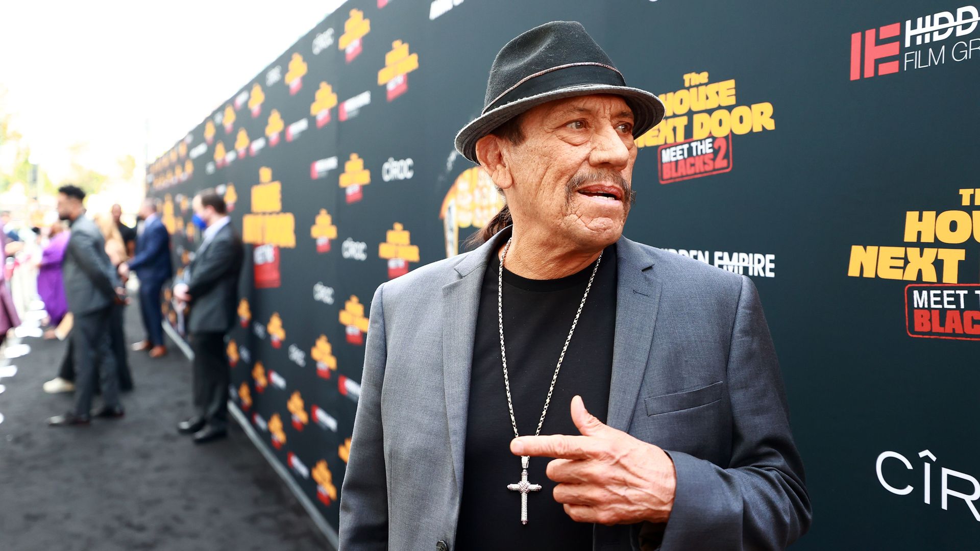 Danny Trejo in a fedora attends the Black Carpet Premiere of Hidden Empire's new film "The House Next Door: Meet the Blacks 2" at Regal LA Live: A Barco Innovation Center. 