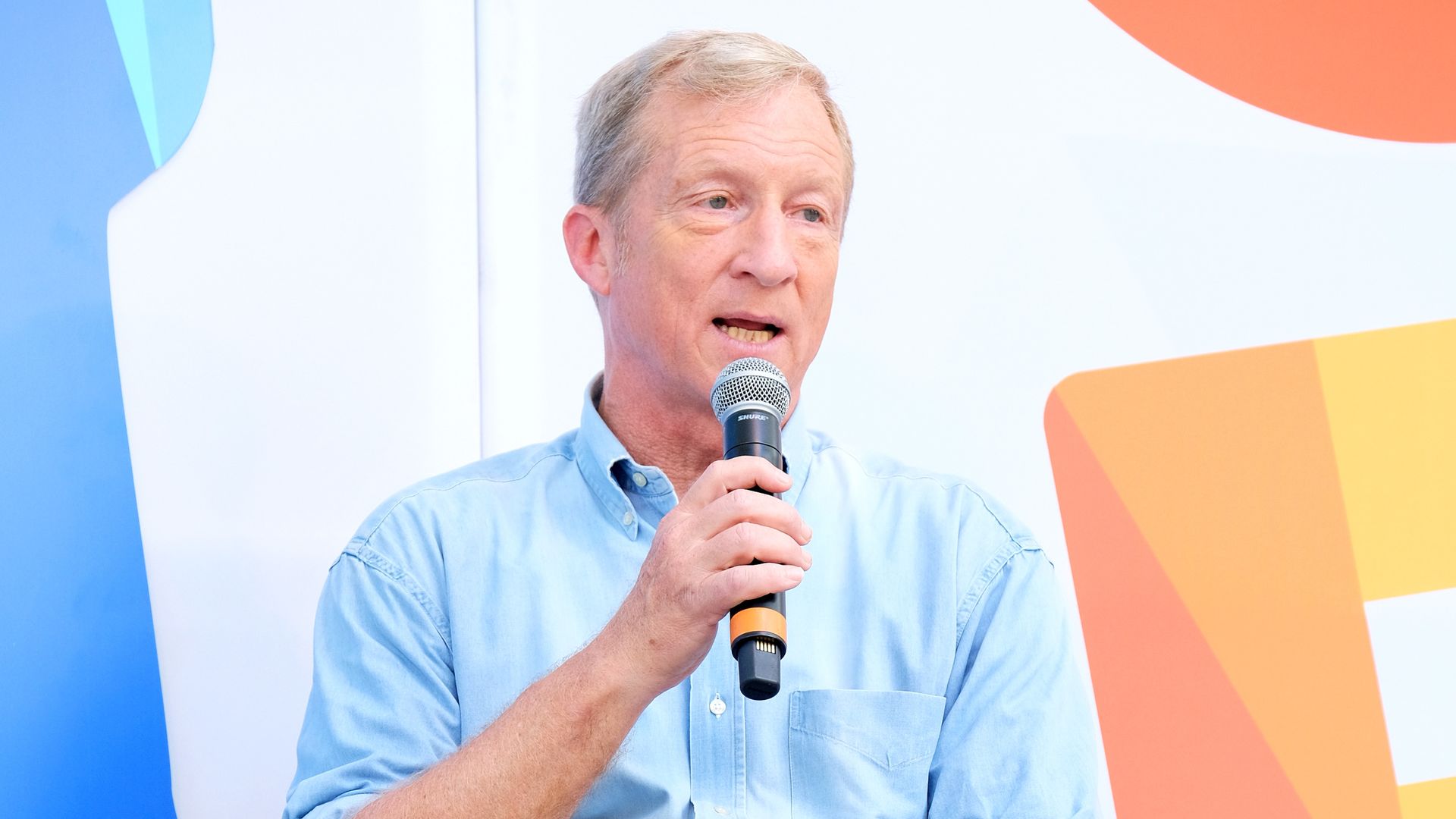 Tom Steyer speaks onstage at a festival
