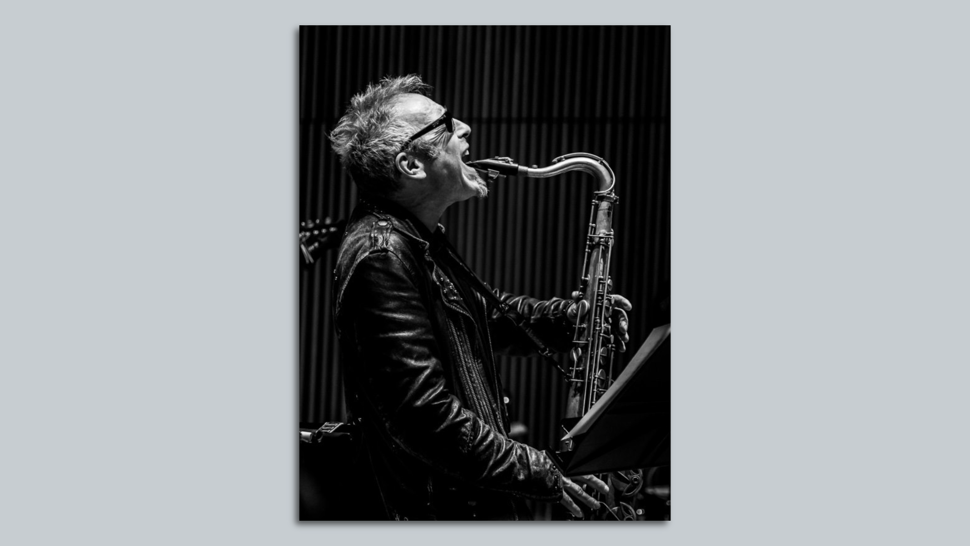 Photo of a man playing saxophone