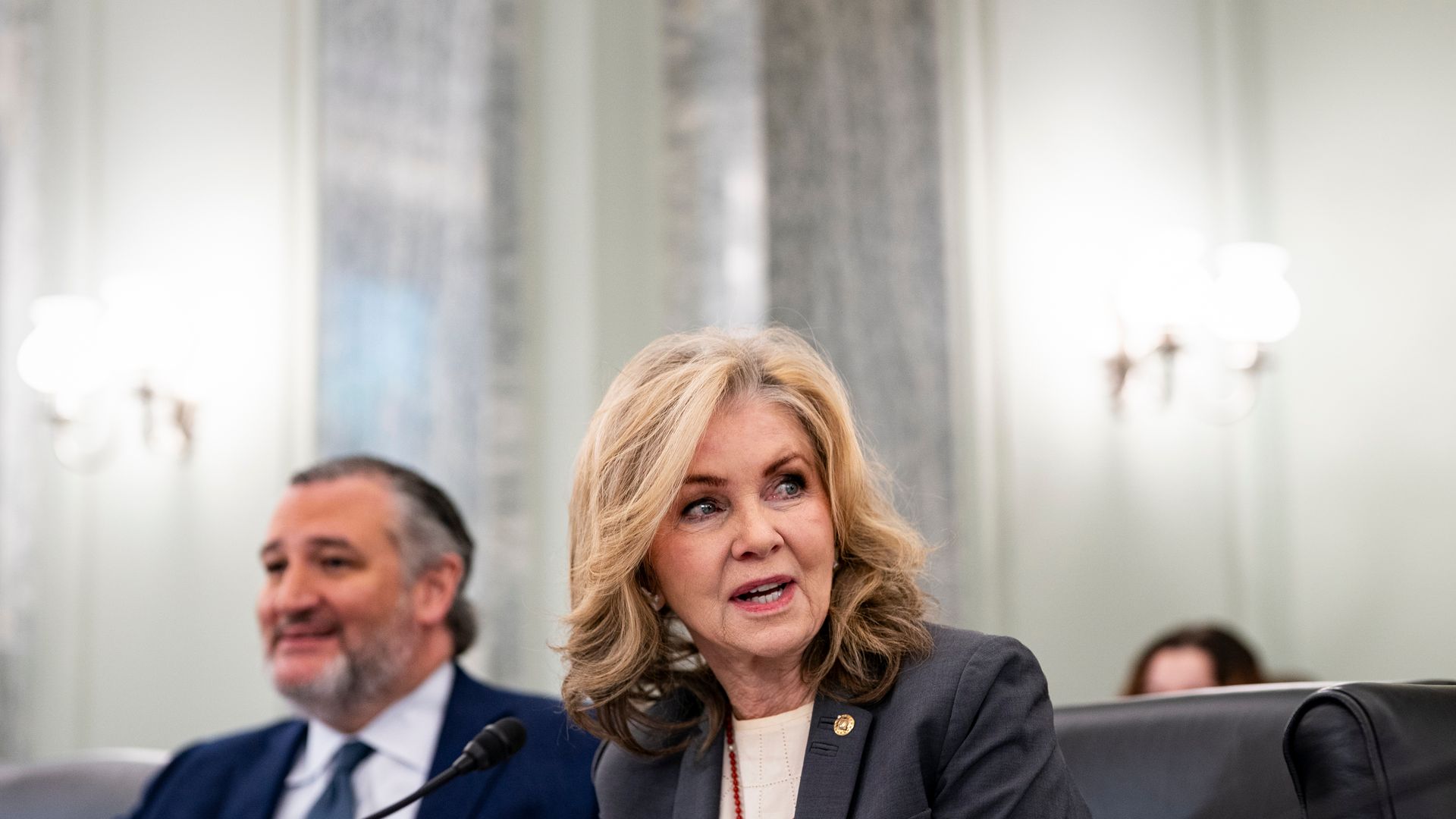 A person speaks in front of a microphone