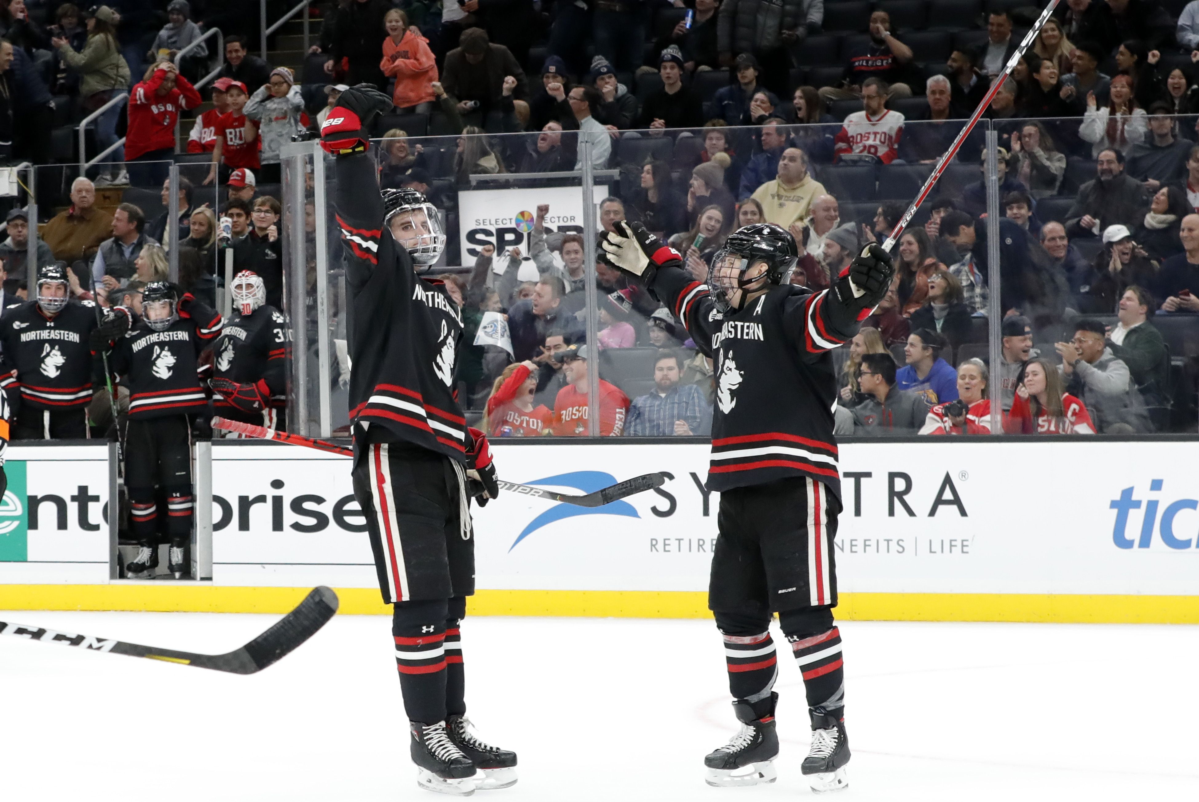 Northeastern hockey players celebrating