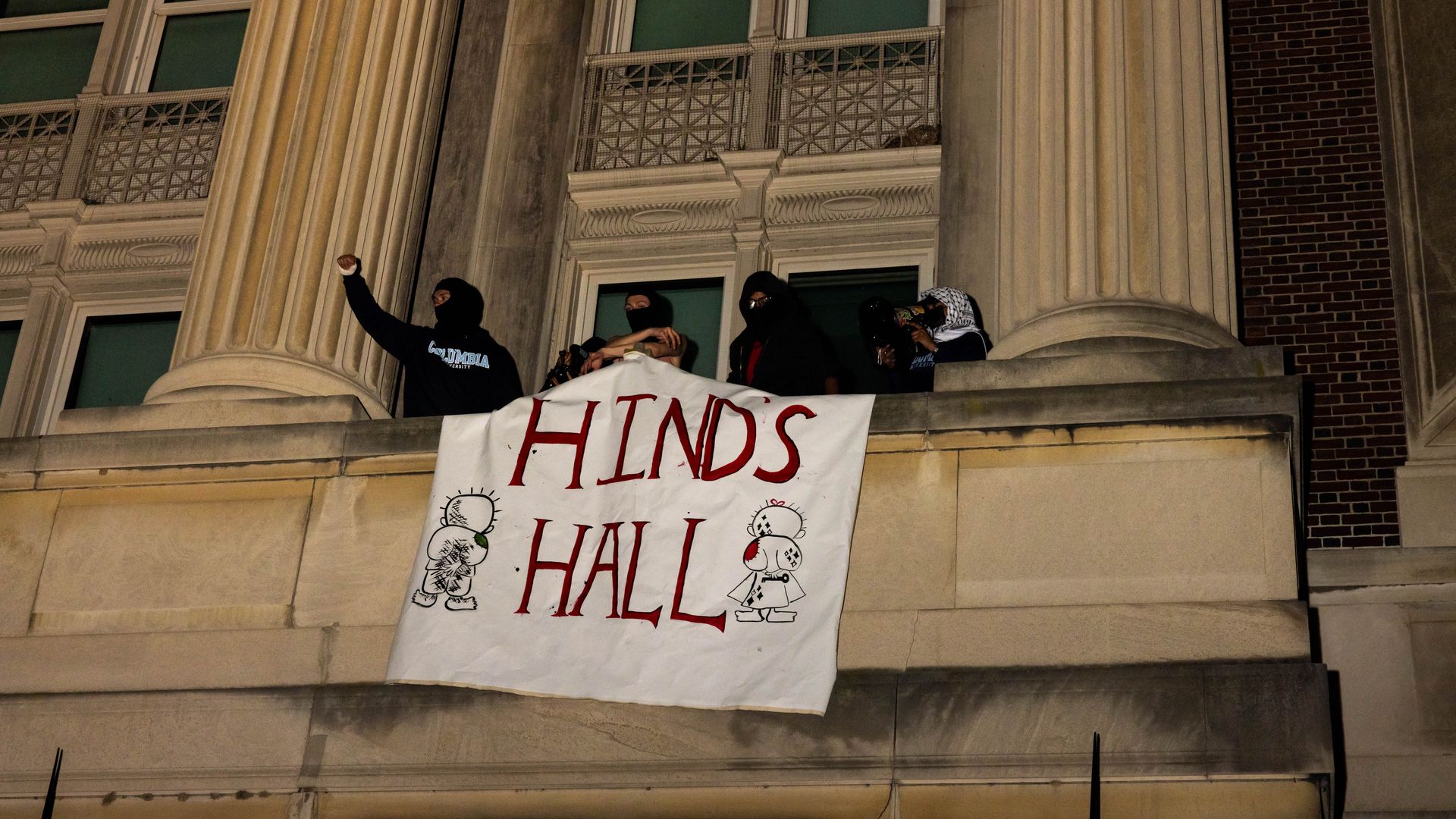 Demonstrators from the pro-Palestine encampment on Columbia's Campus show a banner as they barricade themselves inside Hamilton Hall, they barricade themselves inside Hamilton Hall, an academic building which has been occupied in past student movements,, and name it after a Palestinian child alleged