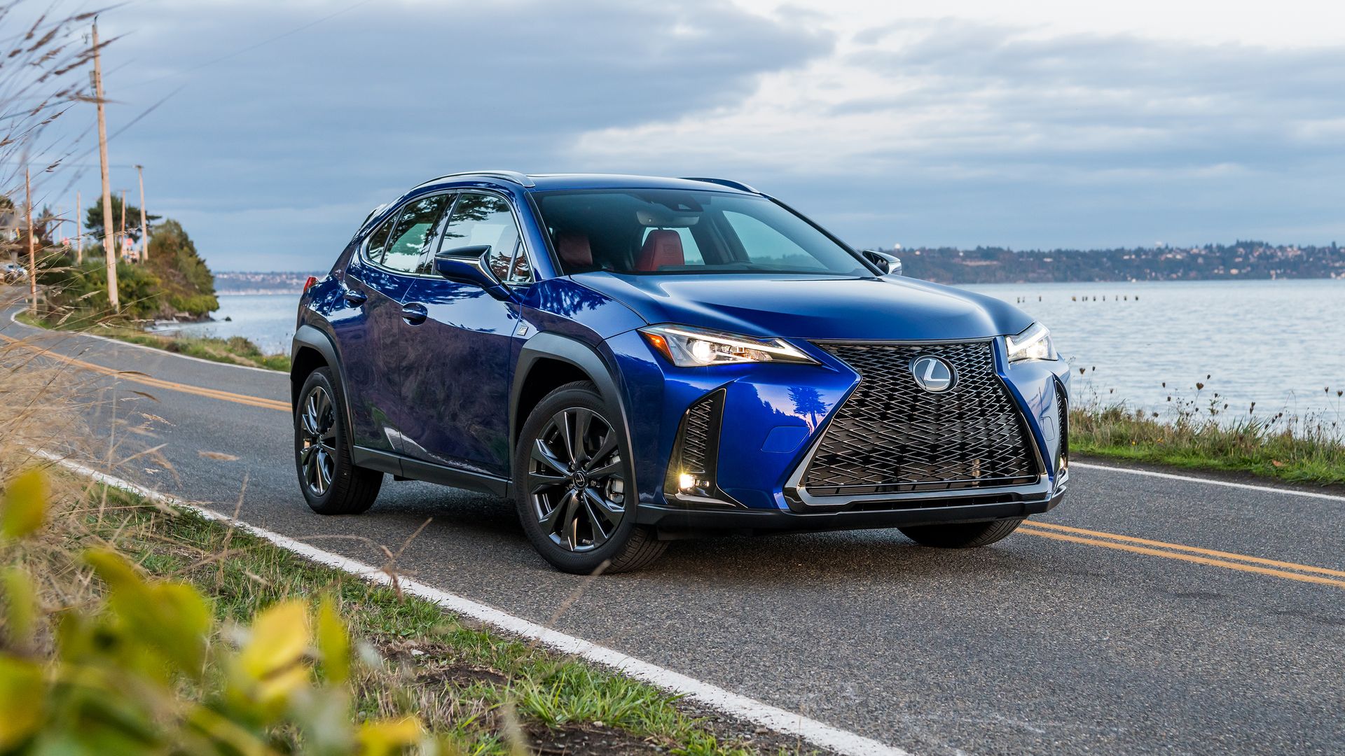 Image of a bright blue Lexus UX compact luxury car 