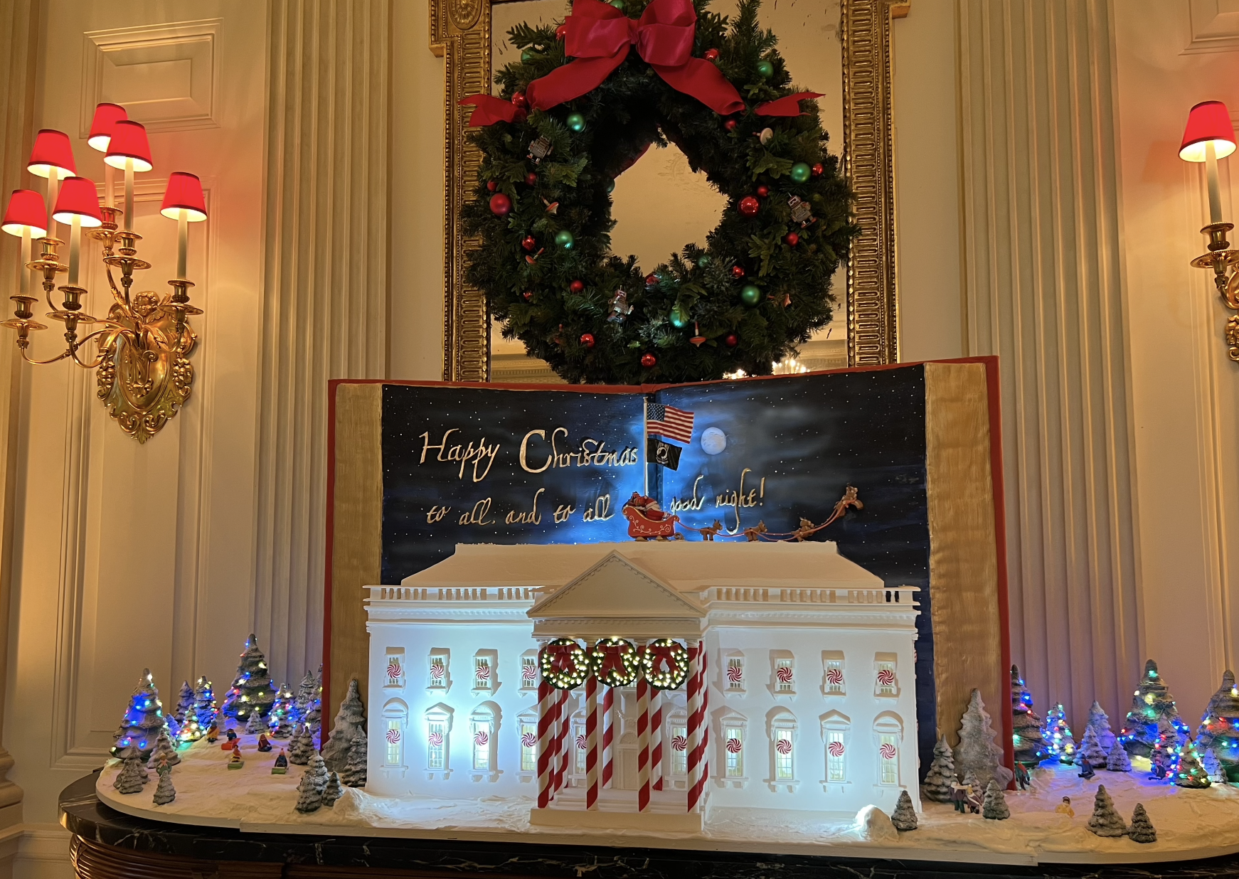 A large gingerbread house modeled after the White House.