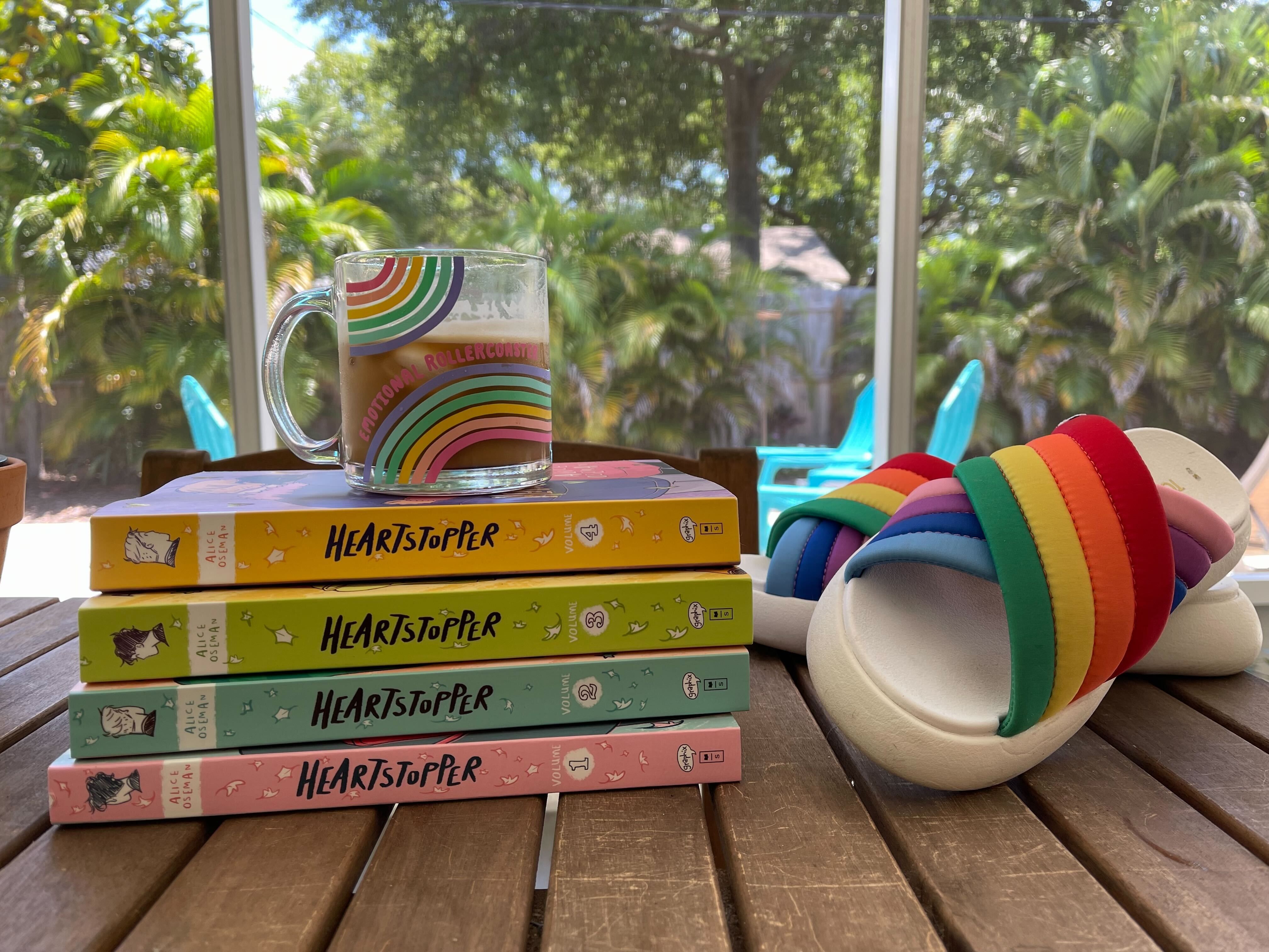 the Heartstopper books and toms mallow pride shoes