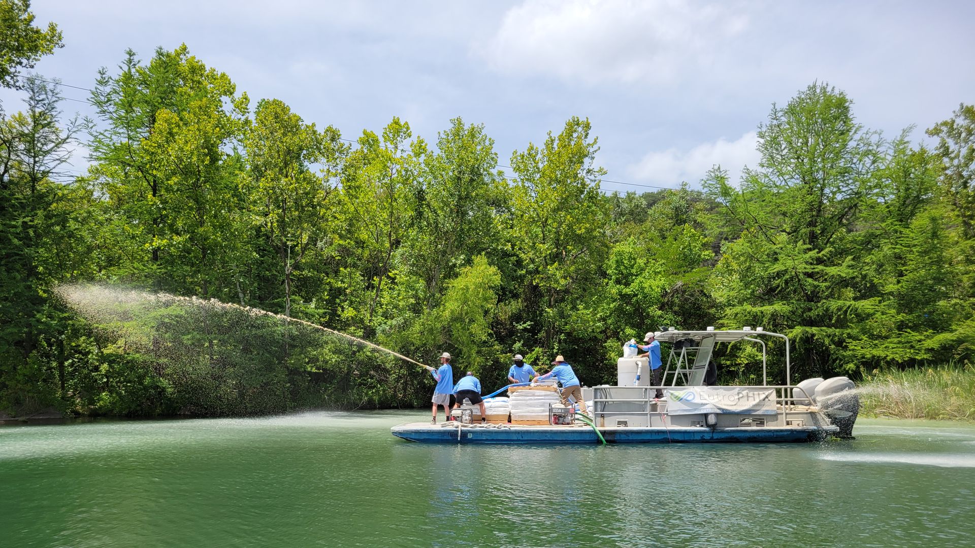 Water being treated with lanthanum-modified clay.