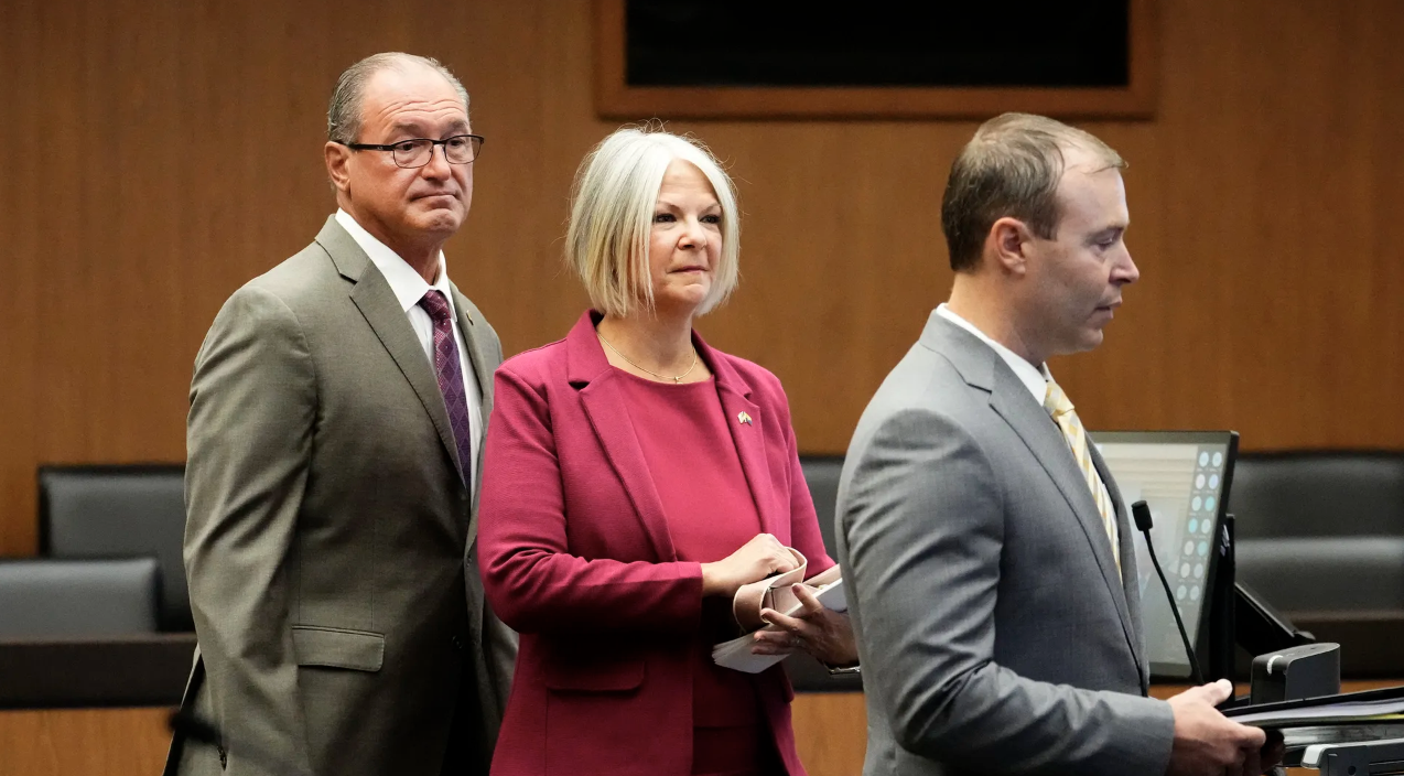 Defendants Michael Ward, left, and Kelli Ward stand with their attorney Bradley Miller, in Maricopa 