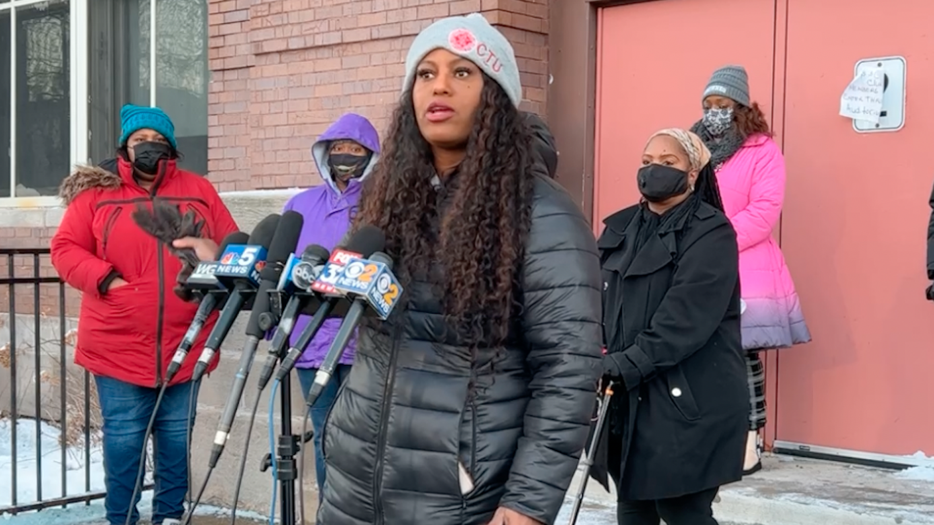 A woman speaks at a podium. 