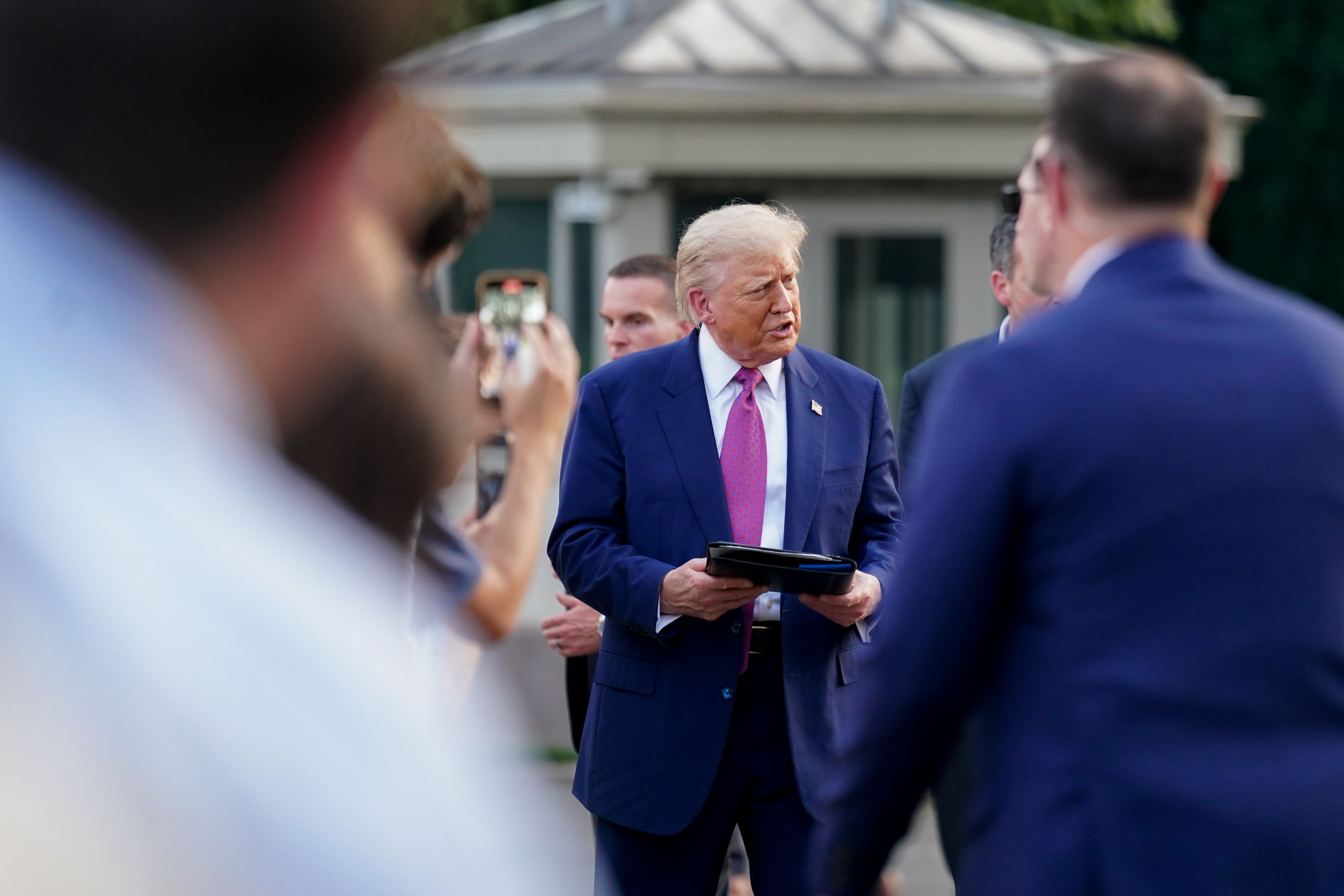 President Trump greets attendees at the White House Congressional picnic on the South Lawn last night.