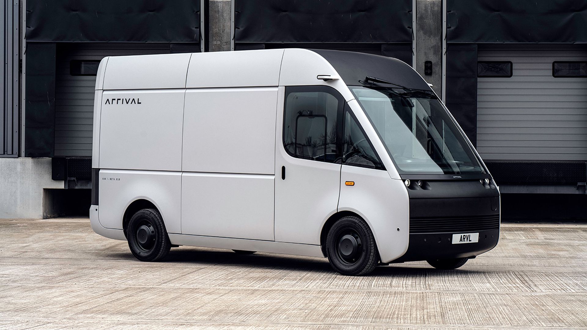 a futuristic looking electric UPS truck, with the same long body but a bigger front window, and an Arrival logo on the side