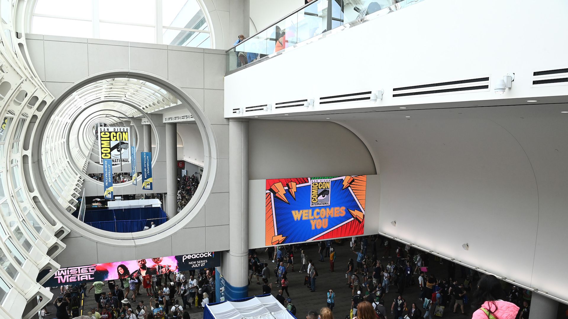 A crowd of people and comic con signage at the San Diego Convention Center.