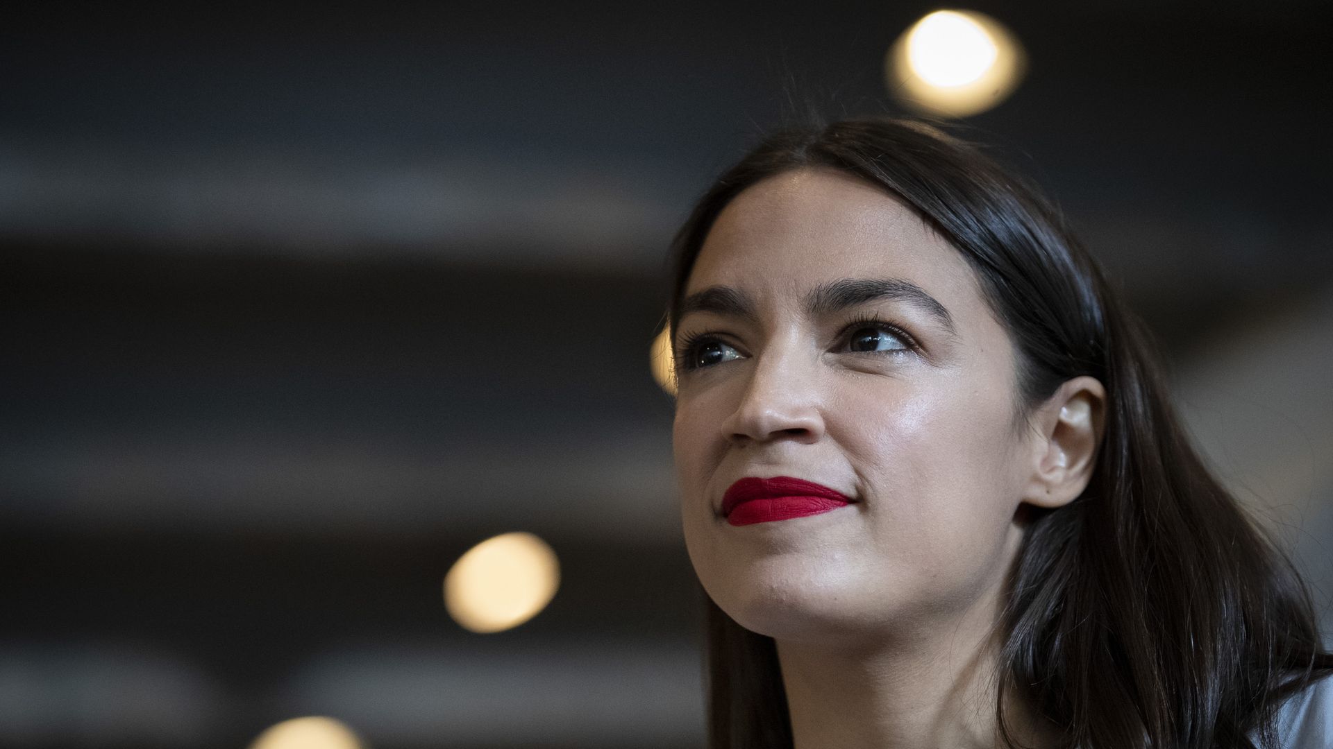 Rep. Alexandria Ocasio-Cortez (D-NY) prepares to wait tables at the Queensboro Restaurant, May 31.