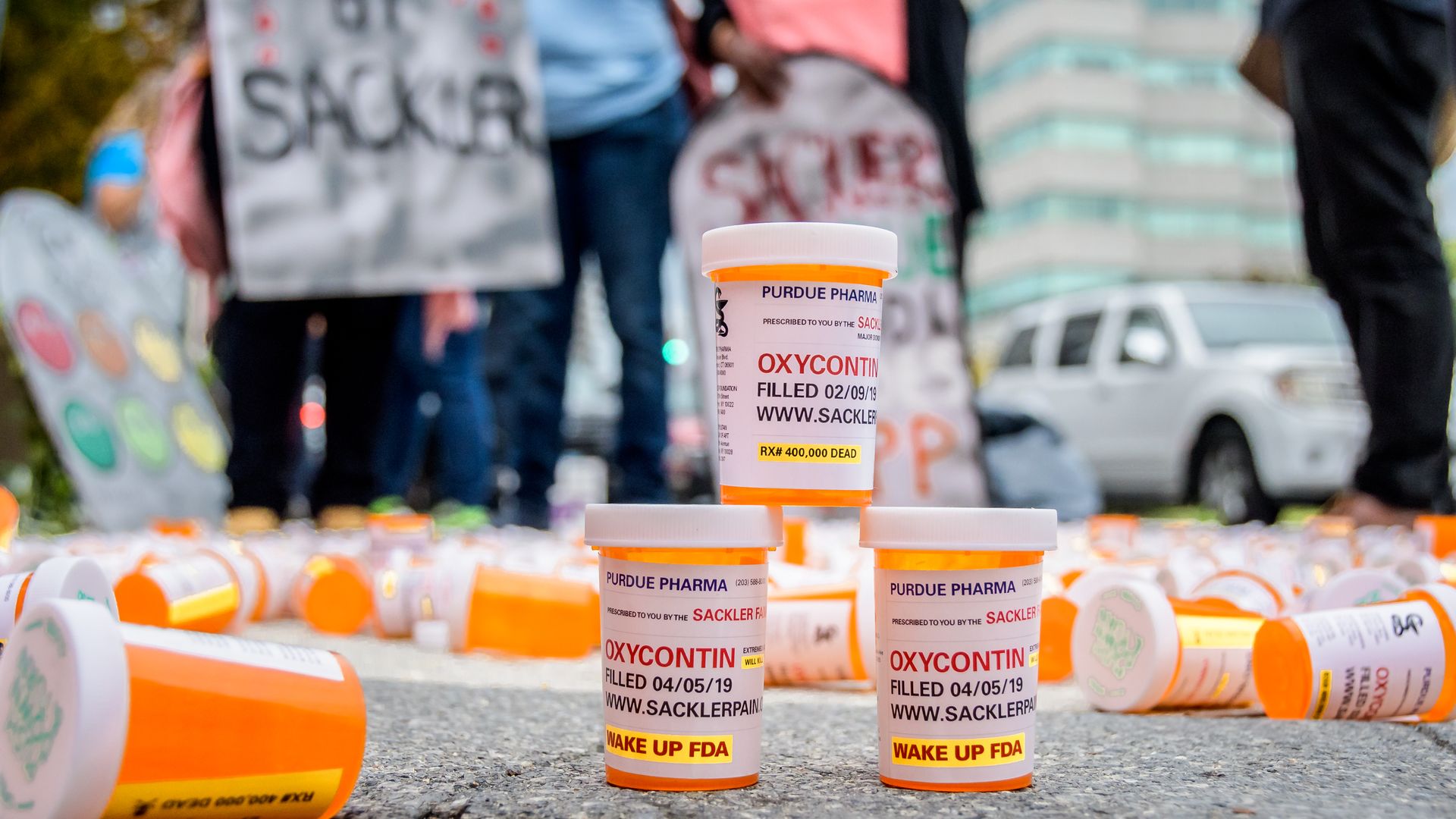 Protestors outside of Purdue Pharma's headquarters