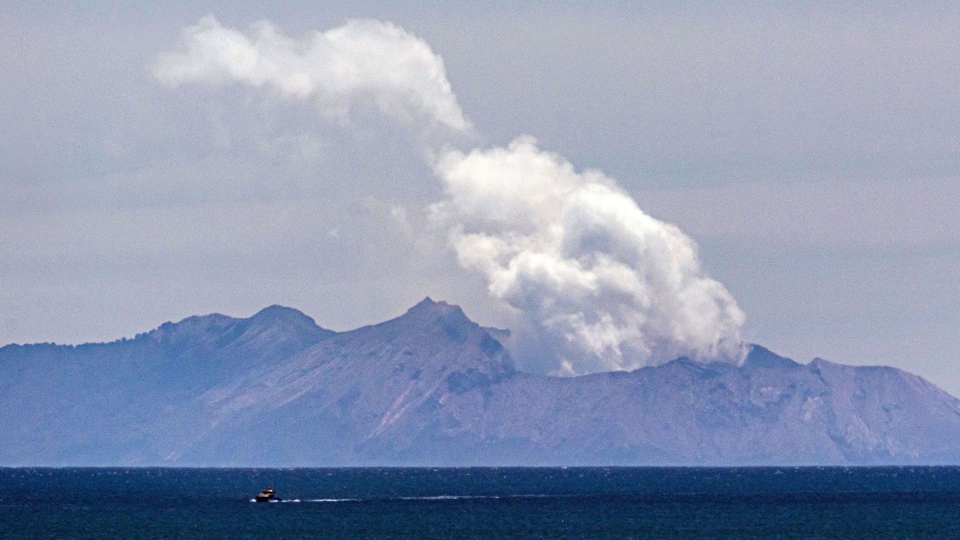  Steam rises from the White Island volcano following the December 9 volcanic eruption, in Whakatane on December 11, 2019. 