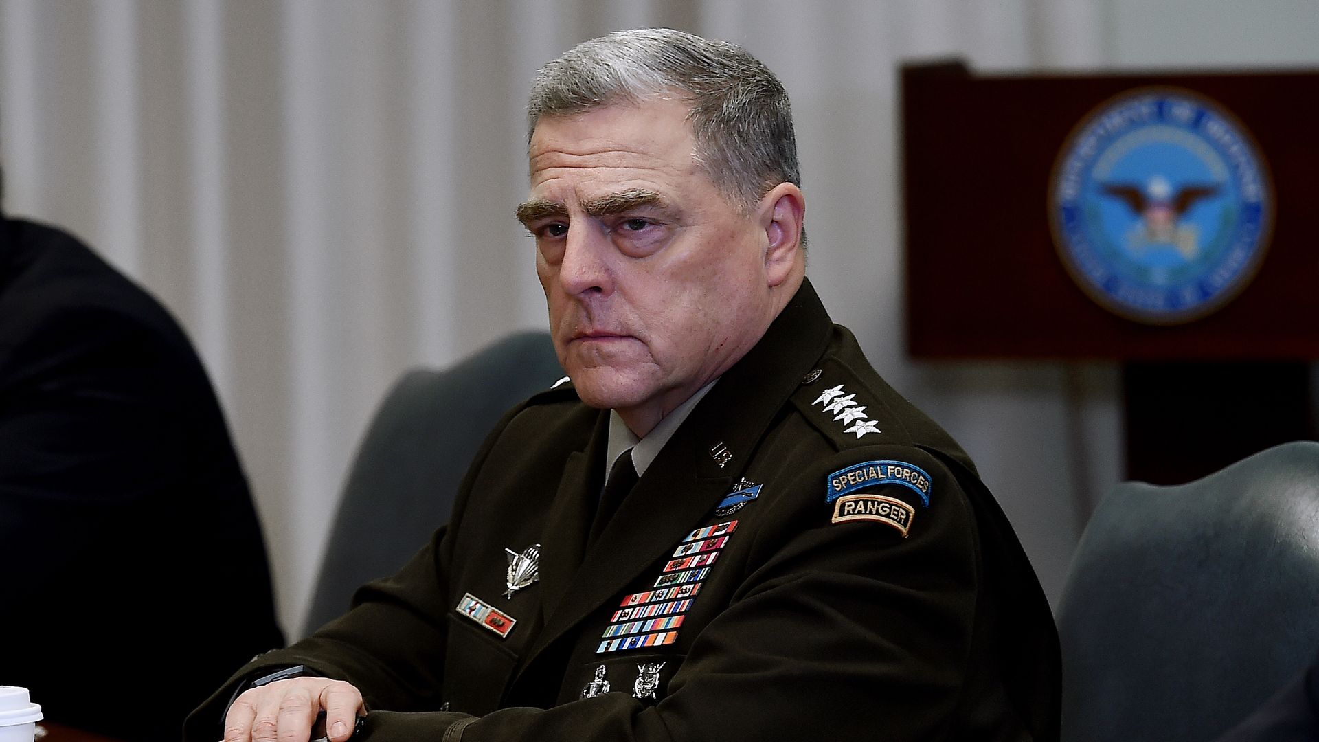 Chairman of the Joint Chiefs of Staff Mark Milley sits and listens during a Pentagon briefing