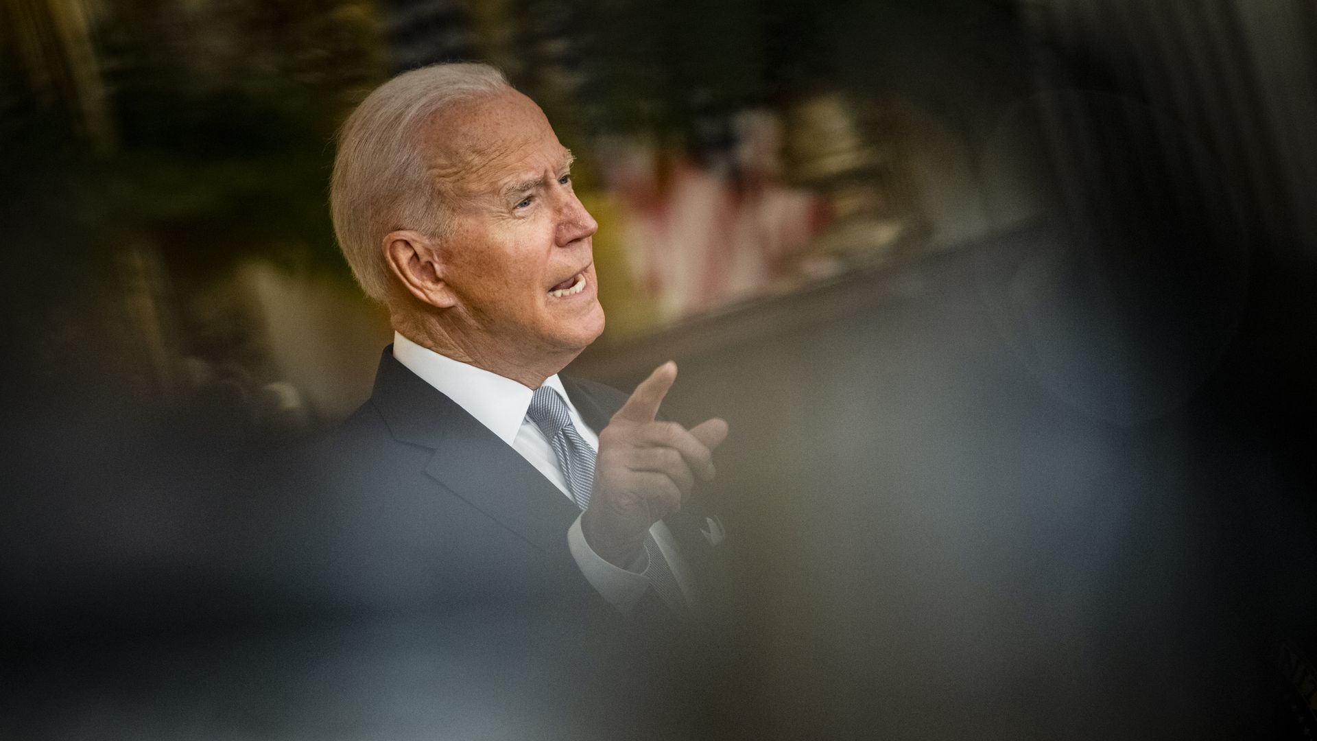 Photo of Joe Biden speaking with one finger raised