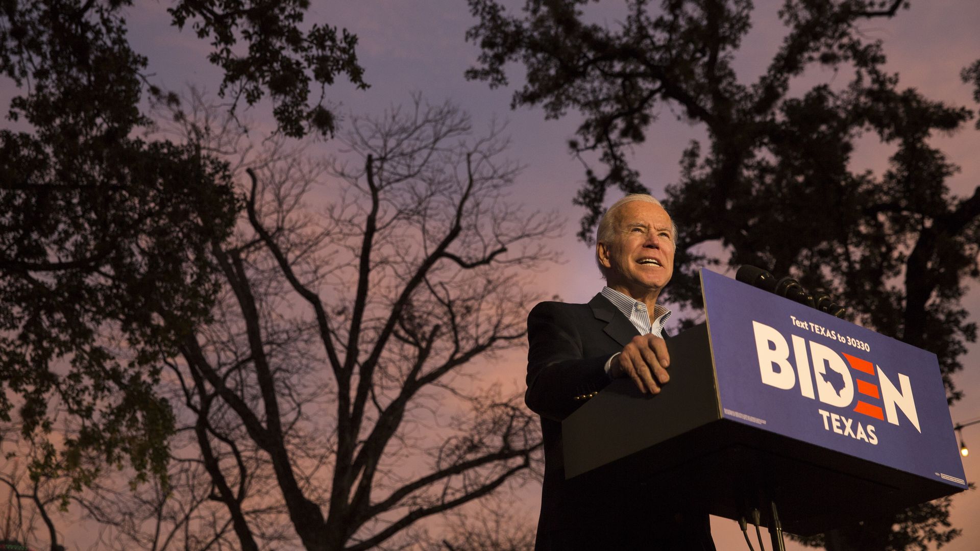 Biden speaking at a podium