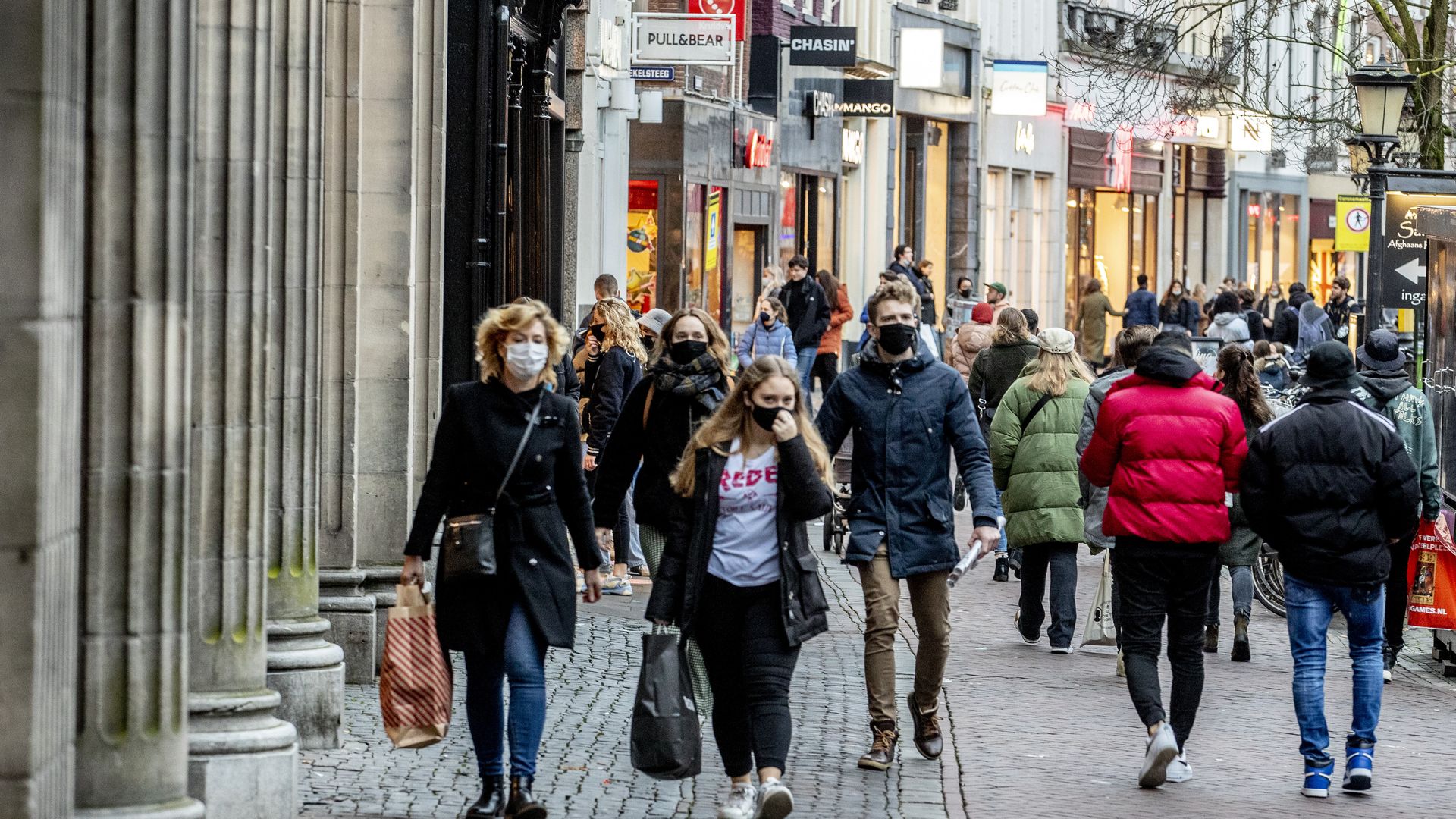 Photo of masked shoppers walking the streets in the Netherlands