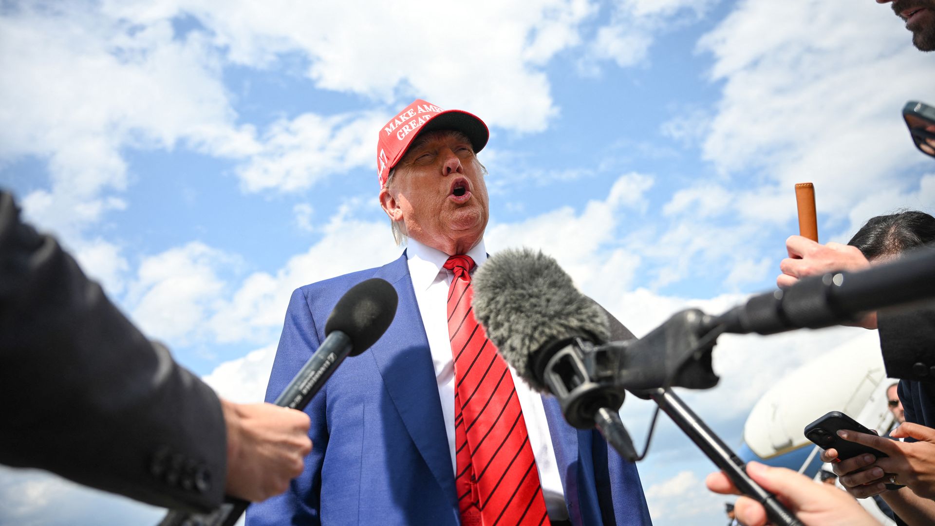 Donald Trump speaks to reporters in New Jersey airport