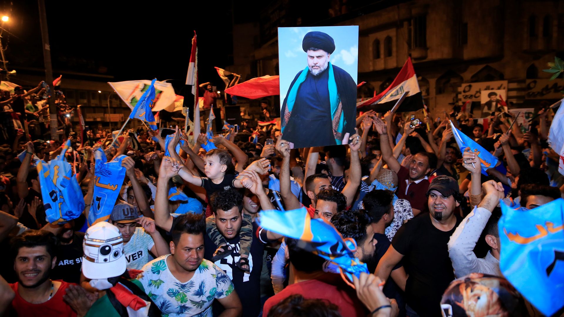 BAGHDAD, IRAQ - MAY 13: Supporters of Iraqi Shiite cleric Moqtada al-Sadr celebrate the results of the parliamentary election at the Tahrir Square, Baghdad, Iraq.